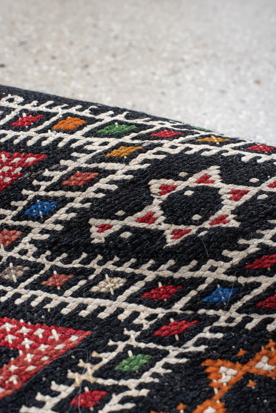 1' x 1' one-of-a-kind handmade vintage Jijim small size rug. Color palette: charcoal, ivory, rust, crimson, orange, blue