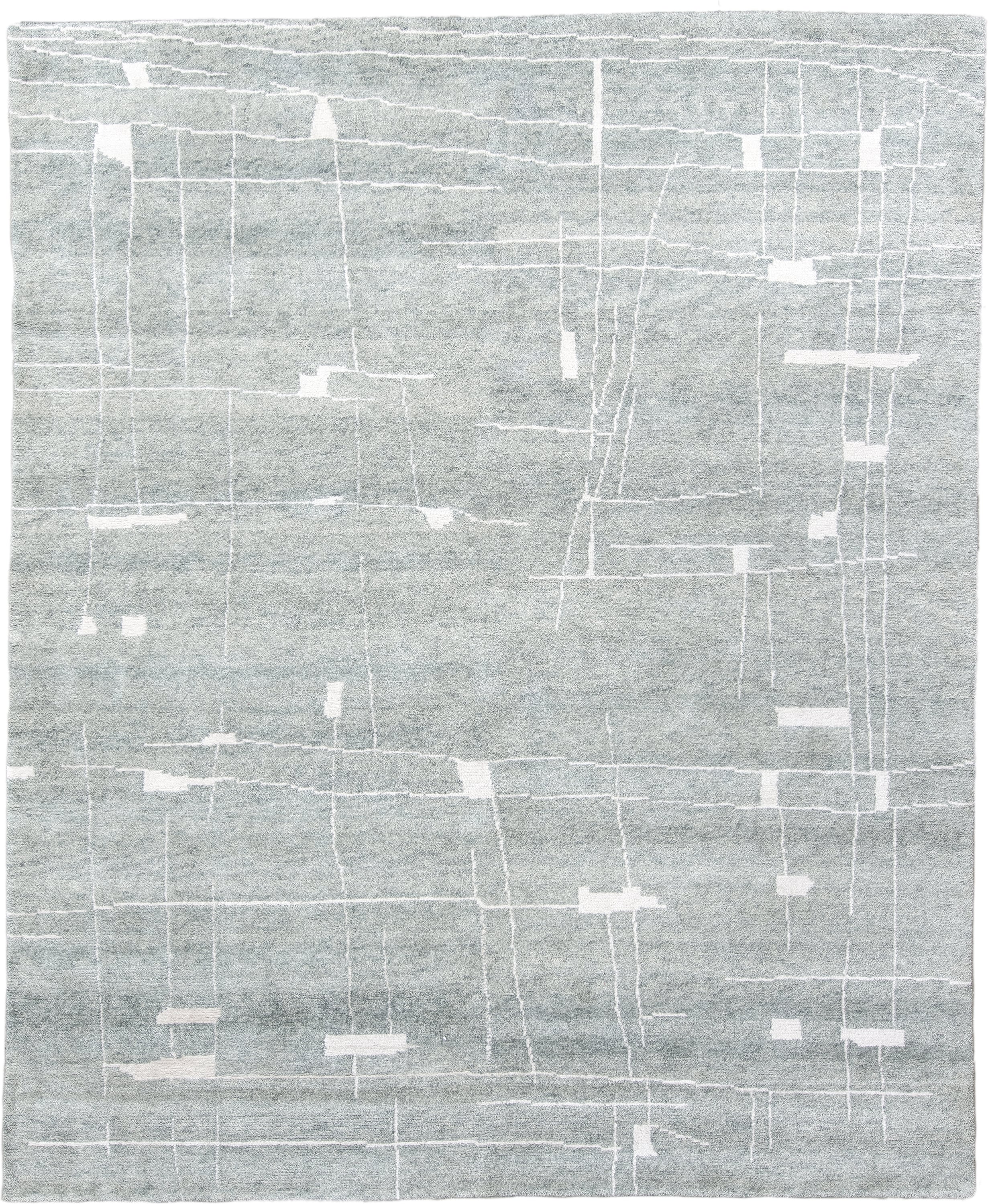 8' x 10' one-of-a-kind handmade vintage Tribeca large size rug. Color palette: pale blue, ivory, silver, mist, light blue