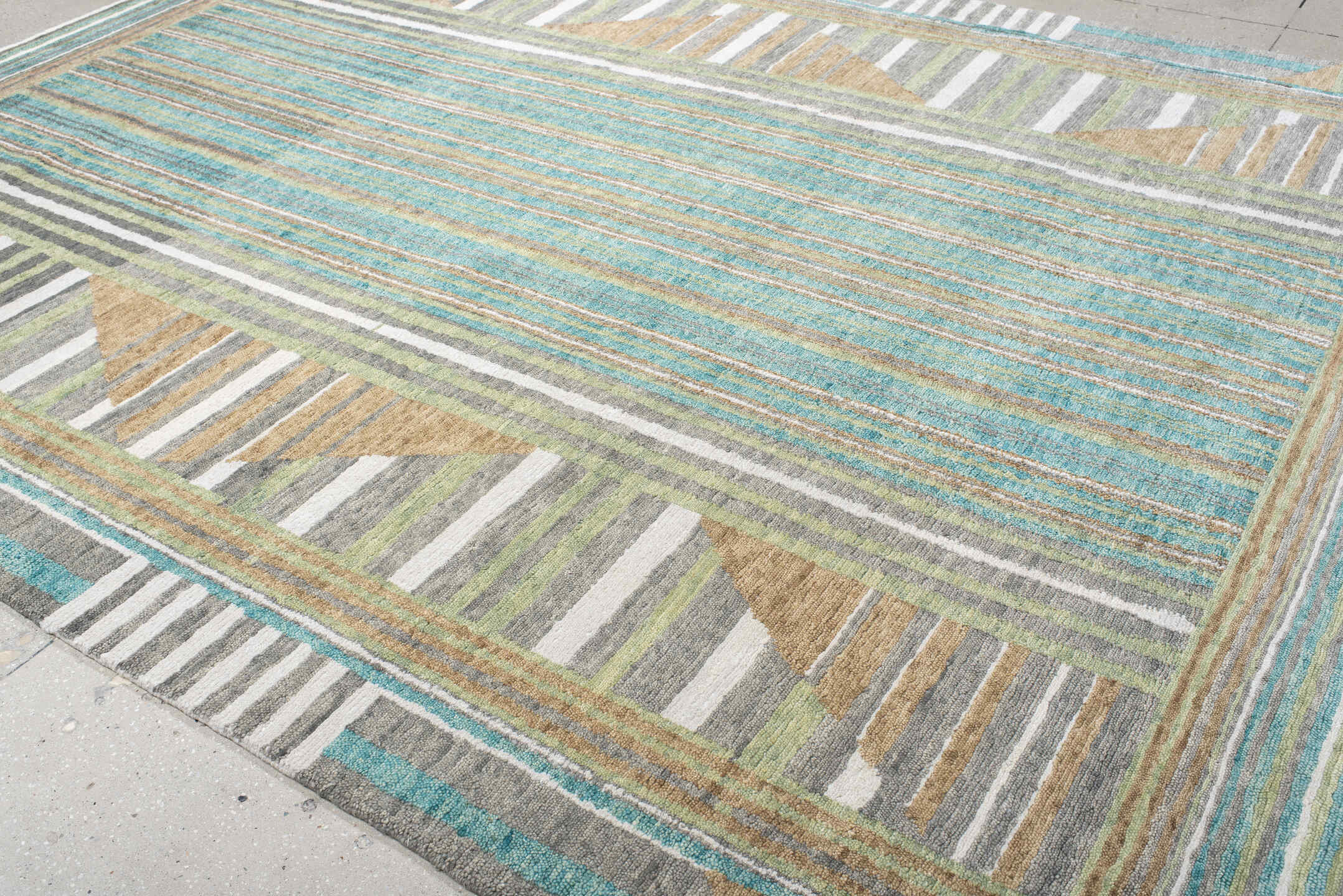 9' x 12' one-of-a-kind handmade vintage Tribeca large size rug. Color palette: teal, ivory, charcoal, taupe, olive, camel
