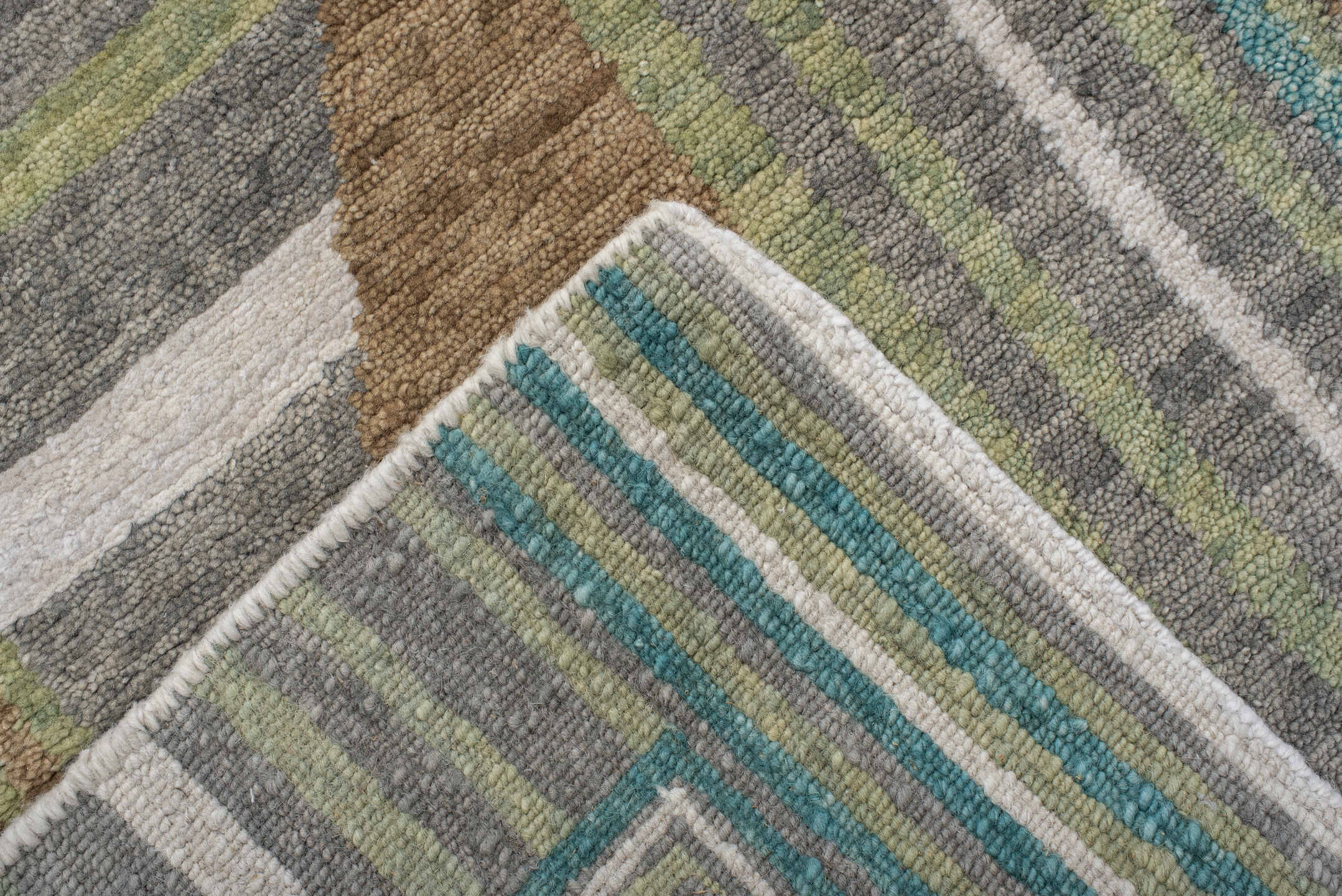 9' x 12' one-of-a-kind handmade vintage Tribeca large size rug. Color palette: teal, ivory, charcoal, taupe, olive, camel