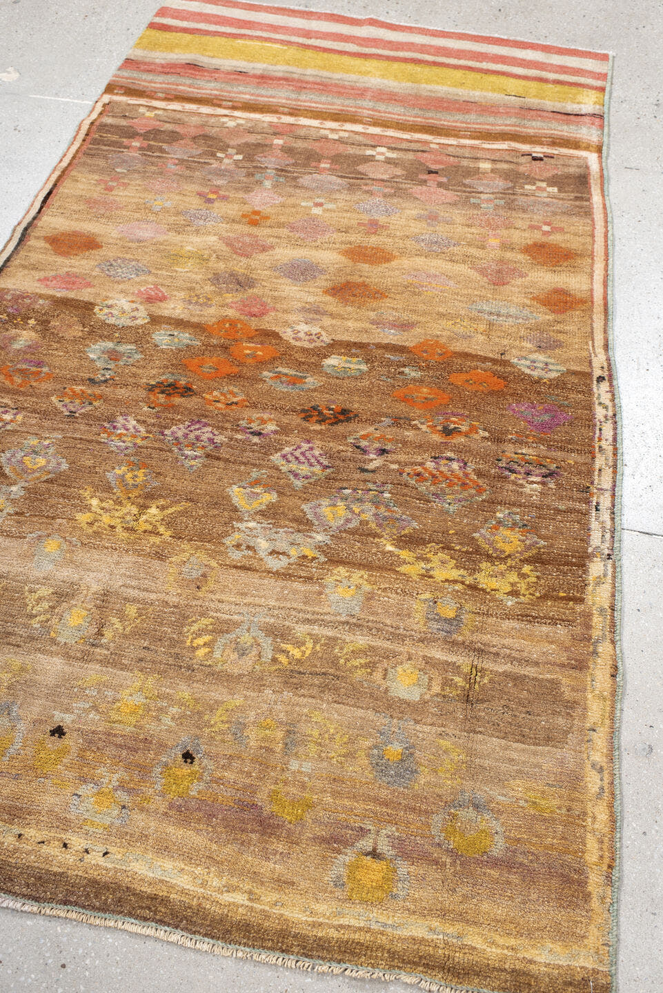 3' x 7' one-of-a-kind handmade vintage Kars rug. Color palette: taupe, camel, ivory, terra cotta, gold, sage, lavender