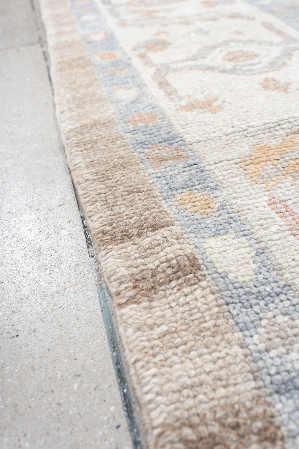 8' x 9' one-of-a-kind handmade vintage Oushak rug. Color palette: taupe, ivory, pale blue, coral, peach, beige, sage, gray