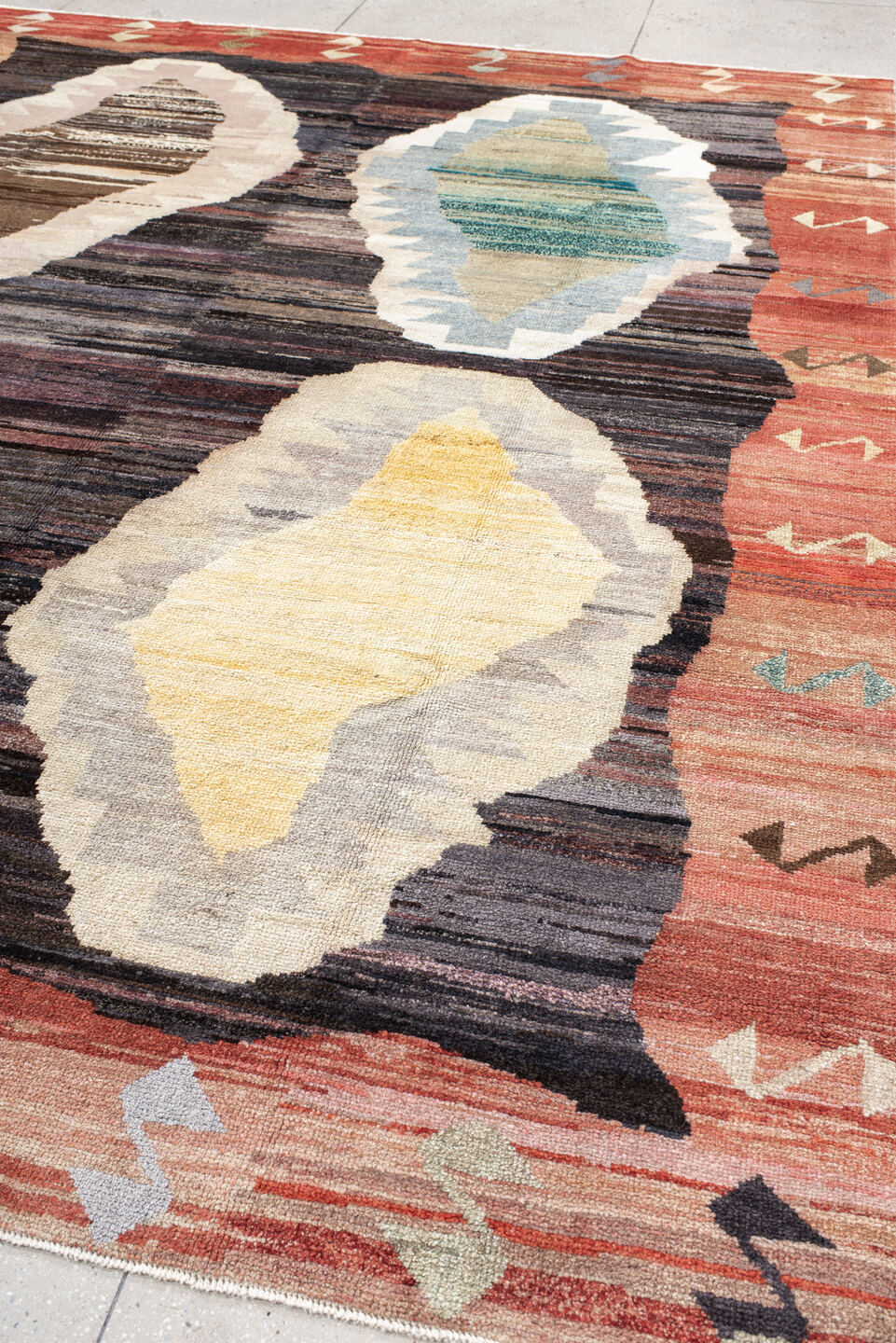 9' x 11' one-of-a-kind handmade vintage Kars large size rug. Color palette: terra cotta, charcoal, ivory, sky blue, taupe
