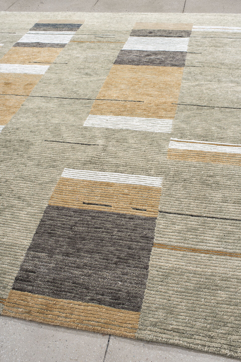 8' x 9' one-of-a-kind handmade vintage Tribeca rug. Color palette: taupe, ivory, camel, charcoal, gray, ochre, beige, black
