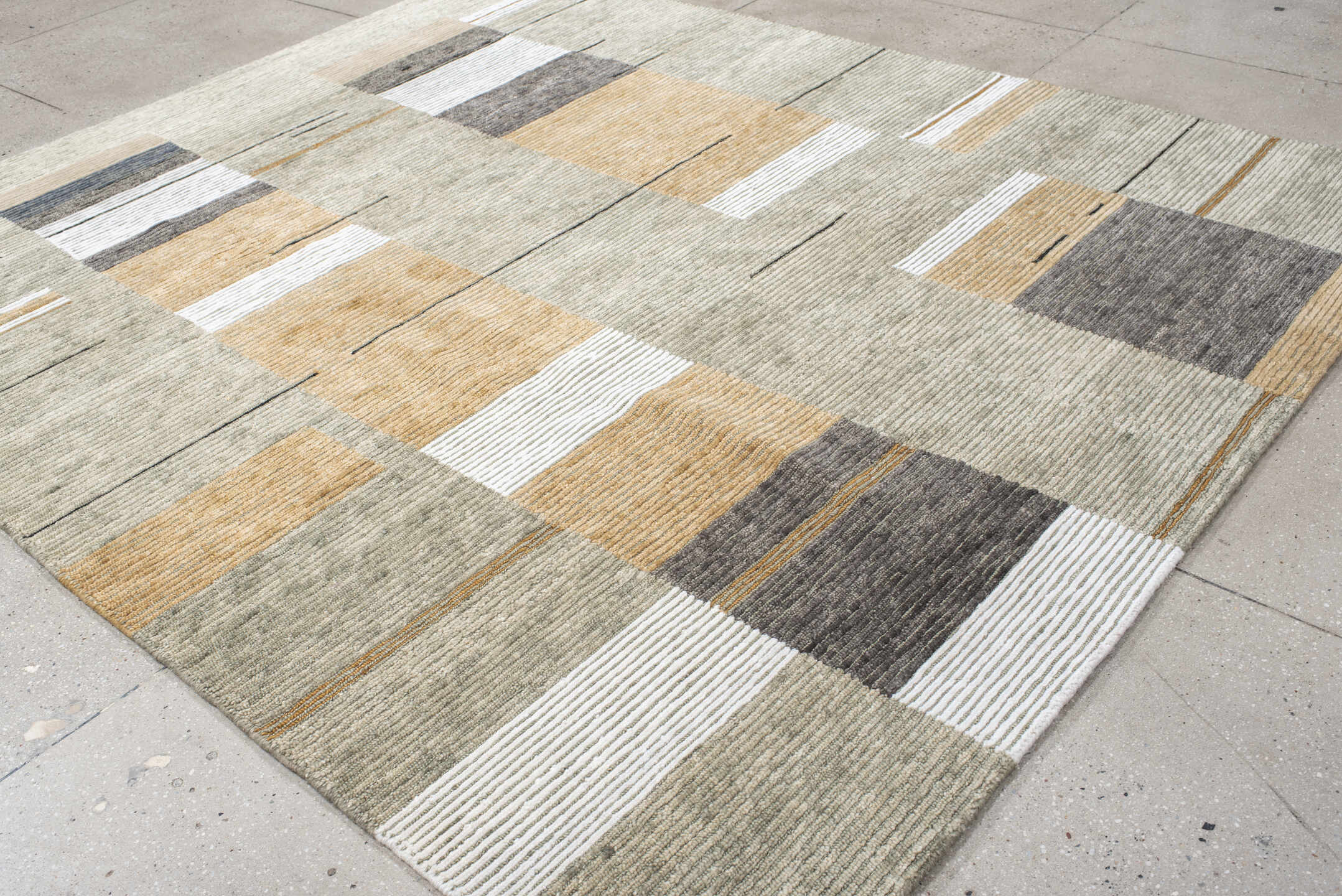 8' x 9' one-of-a-kind handmade vintage Tribeca rug. Color palette: taupe, ivory, camel, charcoal, gray, ochre, beige, black