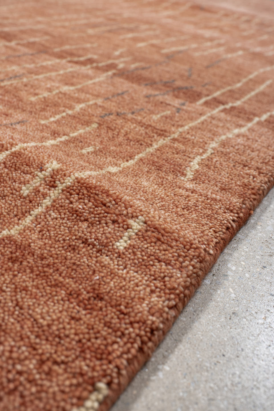 8' x 9' one-of-a-kind handmade vintage Tribeca rug. Color palette: terra cotta, rose, ivory, charcoal, terracotta, brown