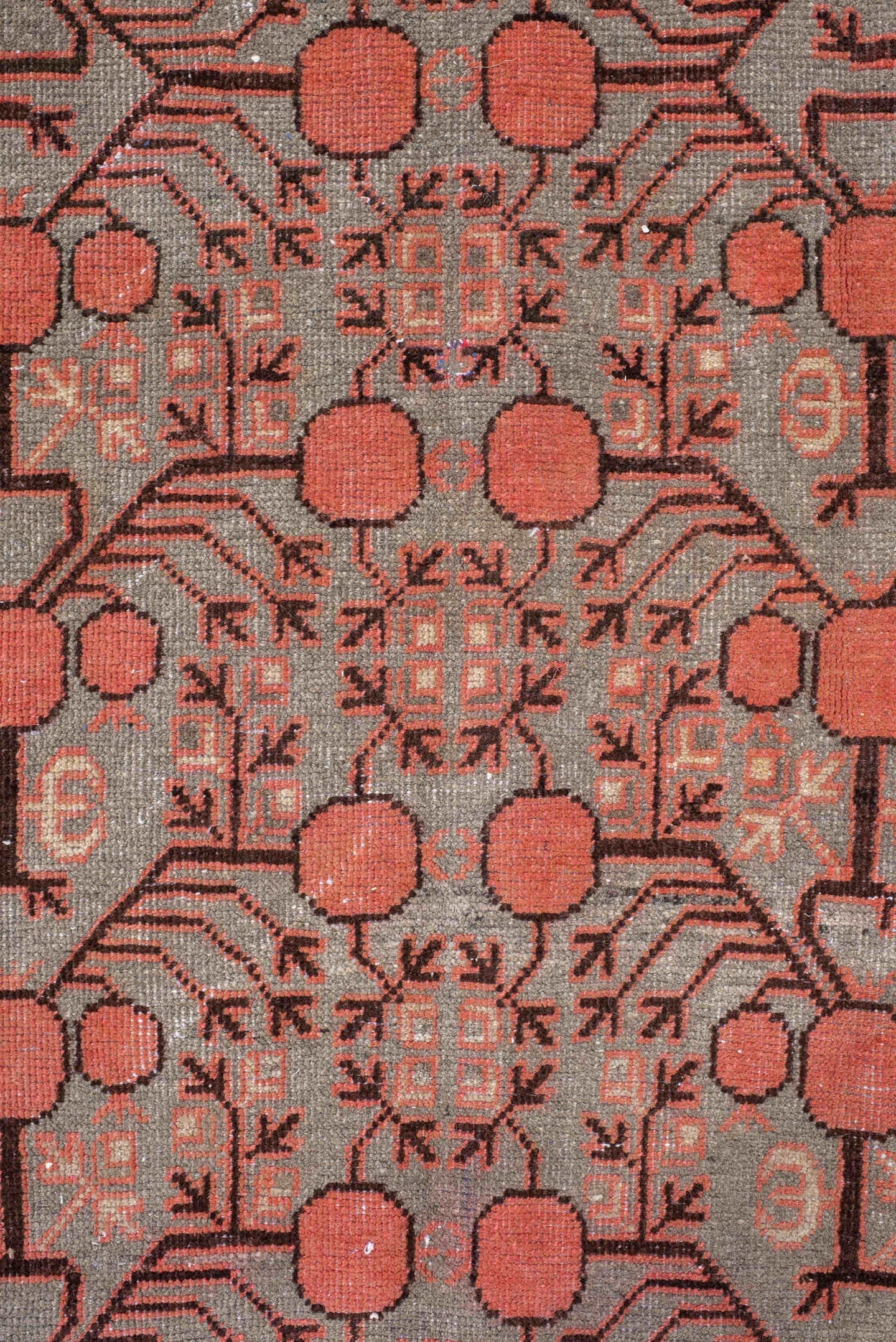 5' x 9' one-of-a-kind handmade antique Khotan medium size rug. Color palette: terra cotta, taupe, charcoal, ivory, rust