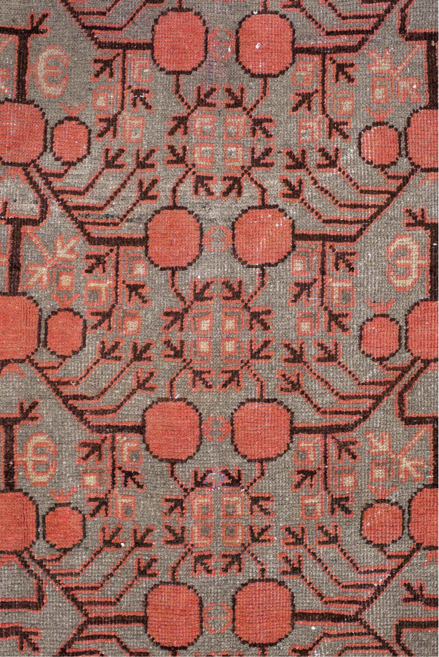 5' x 9' one-of-a-kind handmade antique Khotan medium size rug. Color palette: terra cotta, taupe, charcoal, ivory, rust