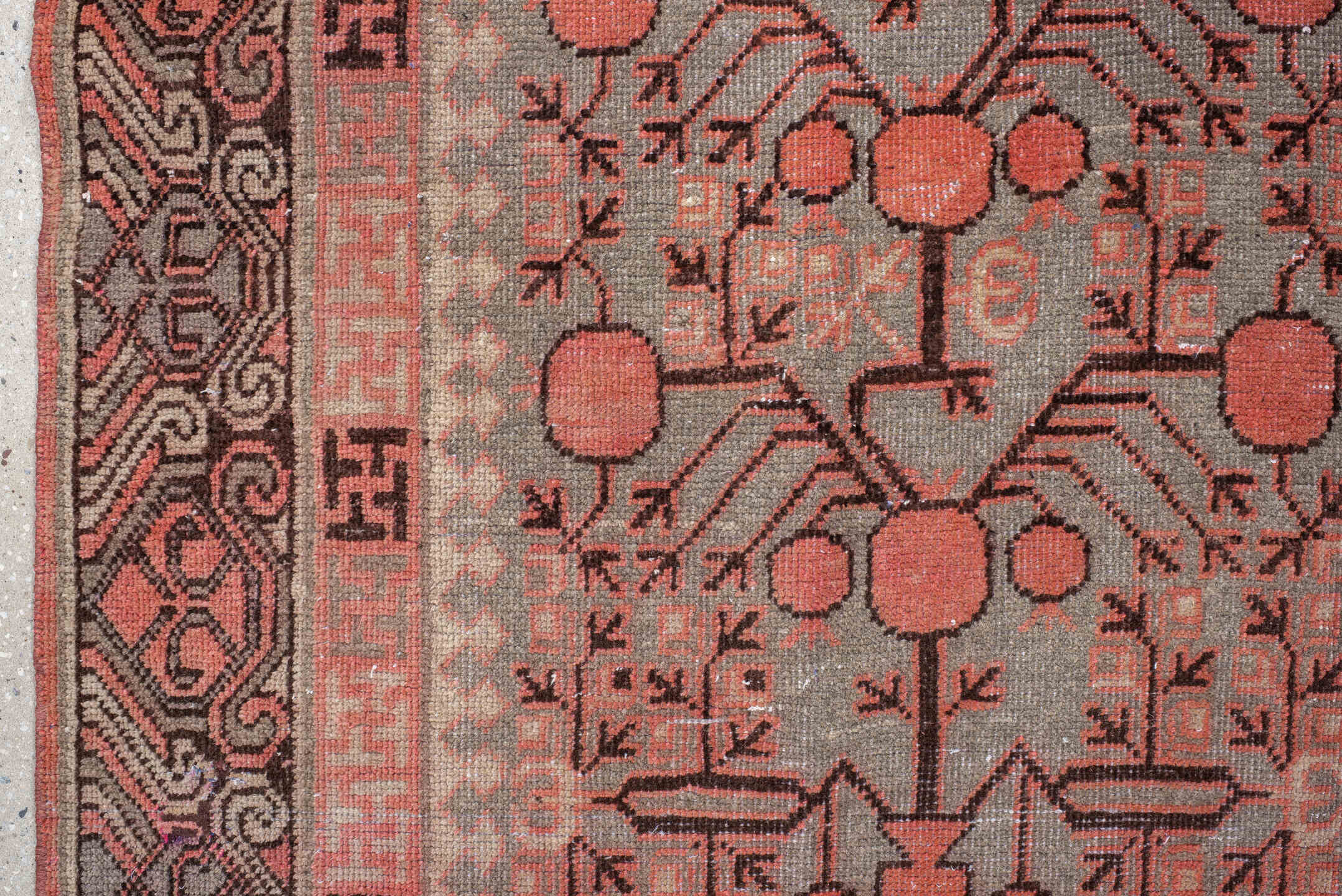 5' x 9' one-of-a-kind handmade antique Khotan medium size rug. Color palette: terra cotta, taupe, charcoal, ivory, rust