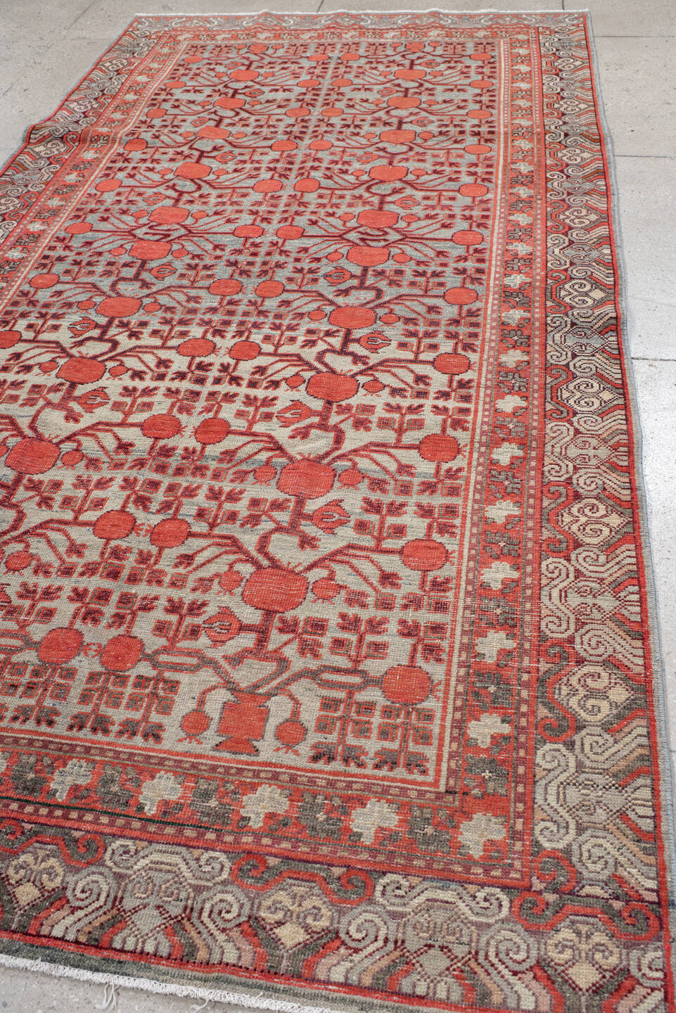 5' x 11' one-of-a-kind handmade vintage Khotan rug. Color palette: coral, ivory, slate, burgundy, rose, charcoal, terracotta