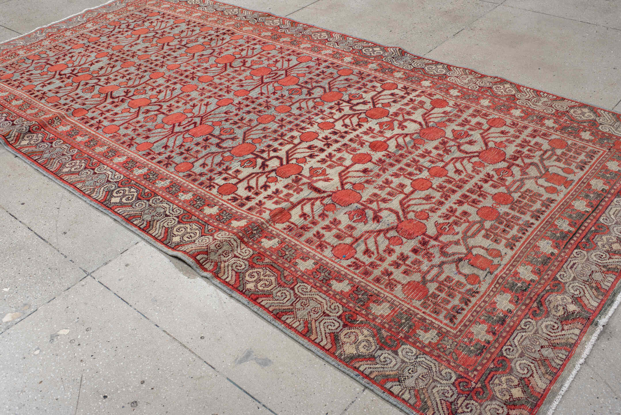 5' x 11' one-of-a-kind handmade vintage Khotan rug. Color palette: coral, ivory, slate, burgundy, rose, charcoal, terracotta