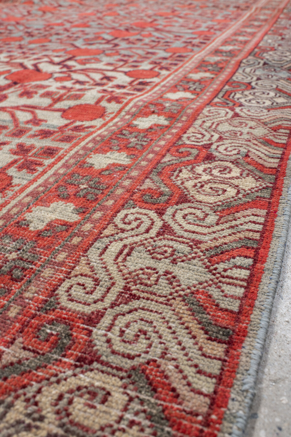 5' x 11' one-of-a-kind handmade vintage Khotan rug. Color palette: coral, ivory, slate, burgundy, rose, charcoal, terracotta