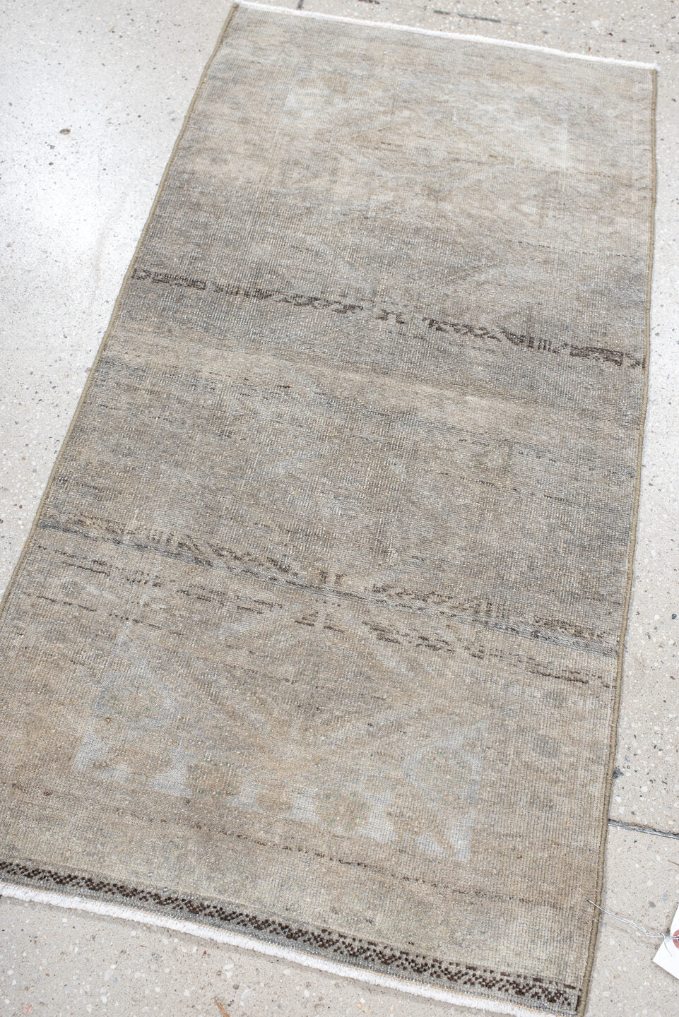 1' x 3' one-of-a-kind handmade antique Belouch small size rug. Color palette: ivory, taupe, beige, brown, gray