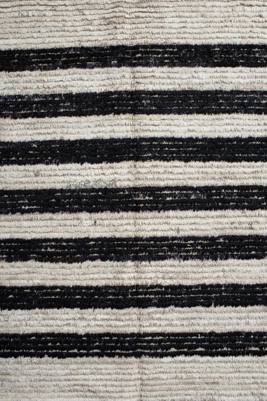 6' x 9' one-of-a-kind handmade vintage Tulu medium size rug. Color palette: ivory, charcoal, beige, gray, black
