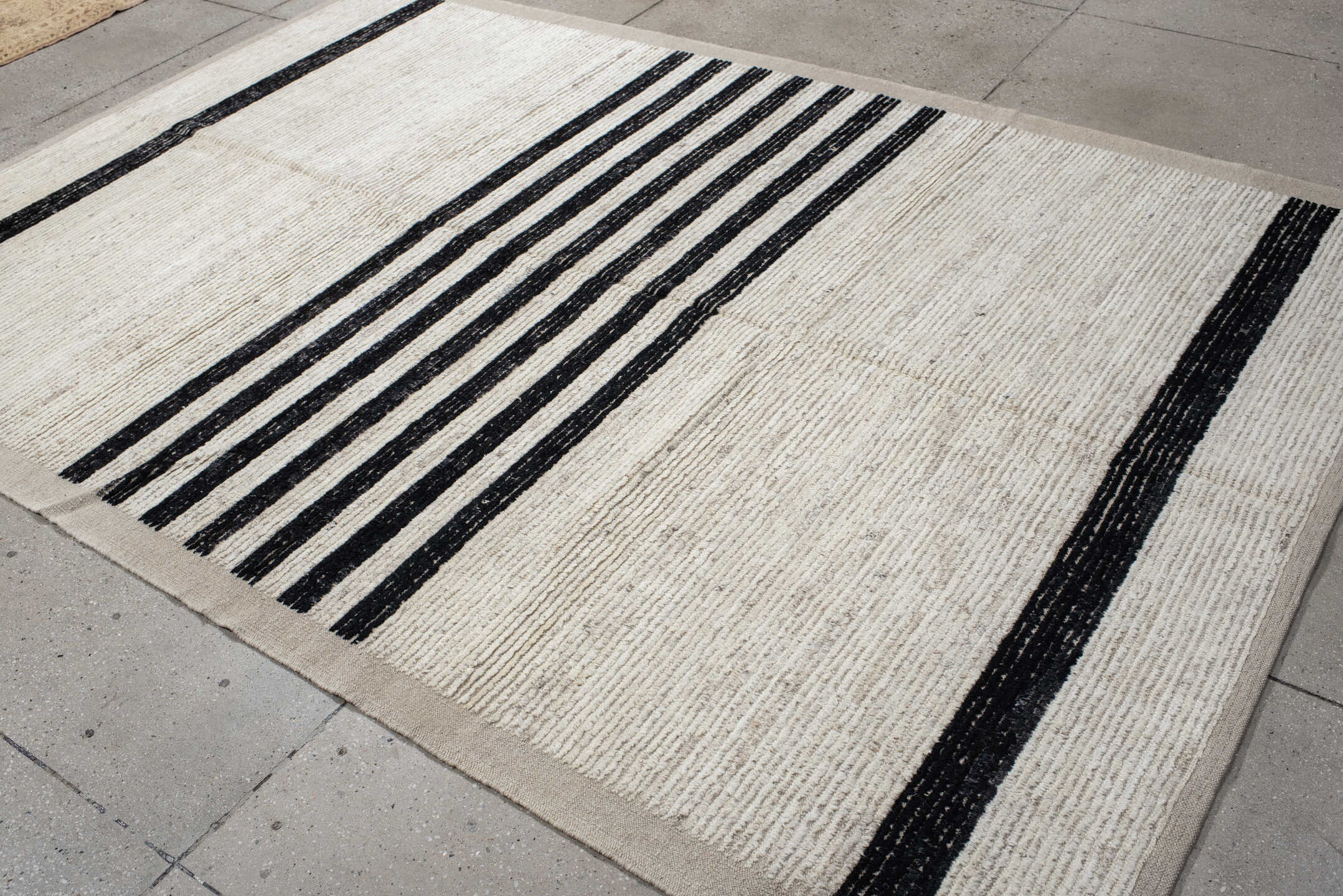 6' x 9' one-of-a-kind handmade vintage Tulu medium size rug. Color palette: ivory, charcoal, beige, gray, black