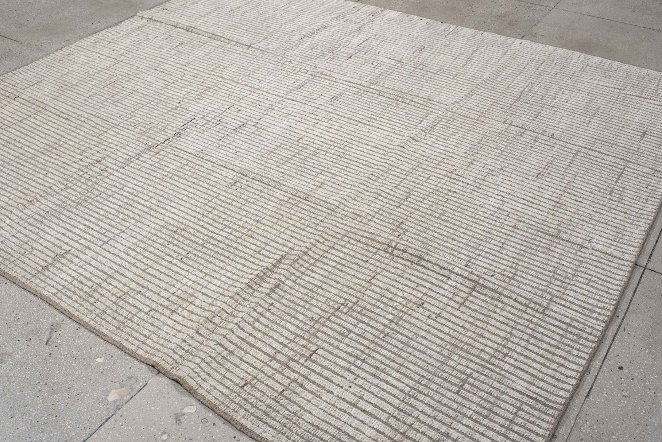 8' x 9' one-of-a-kind handmade vintage Tulu rug. Color palette: ivory, taupe, beige, cream, gray