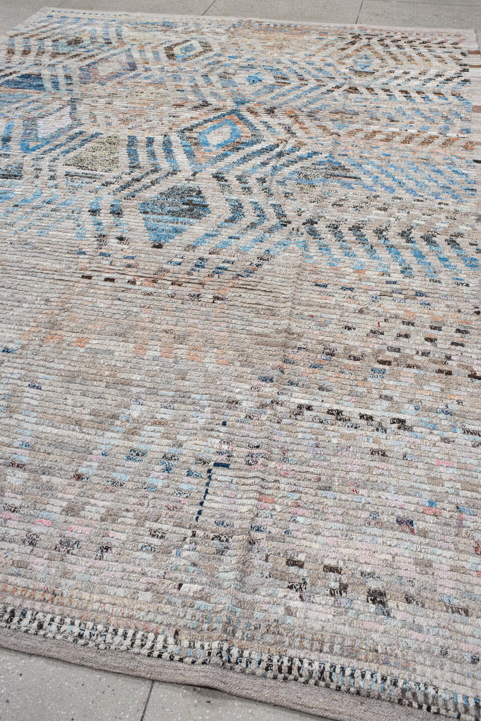8' x 12' one-of-a-kind handmade vintage Tulu large size rug. Color palette: ivory, sky blue, taupe, charcoal, peach, gray
