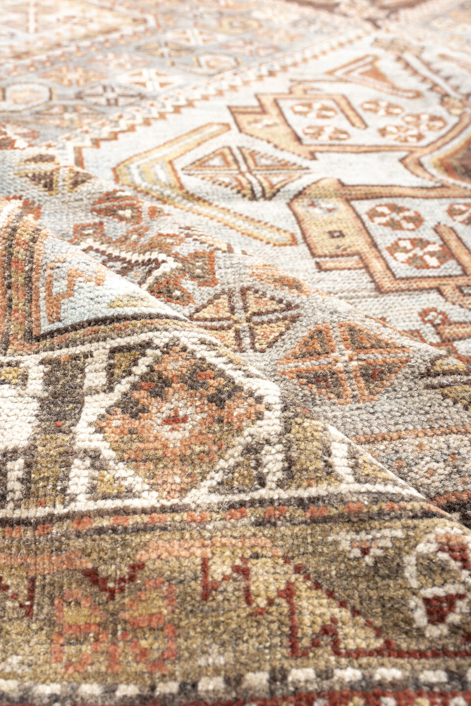 6' x 9' one-of-a-kind handmade antique Qashqai rug. Color palette: taupe, ivory, rust, slate, brown, camel, charcoal, beige