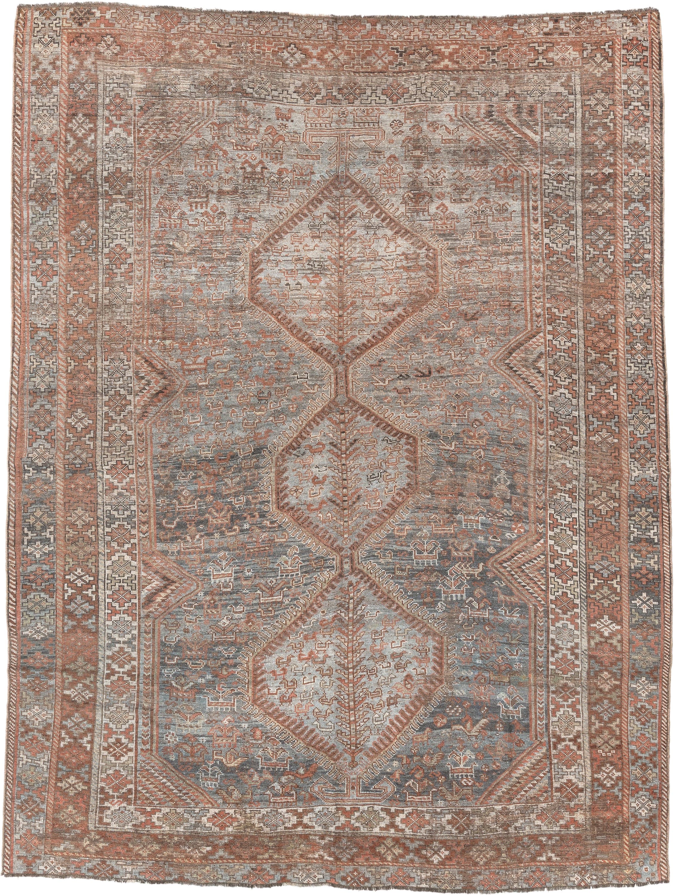 6' x 8' one-of-a-kind handmade antique Shiraz medium size rug. Color palette: blue, rust, ivory, taupe, slate, camel