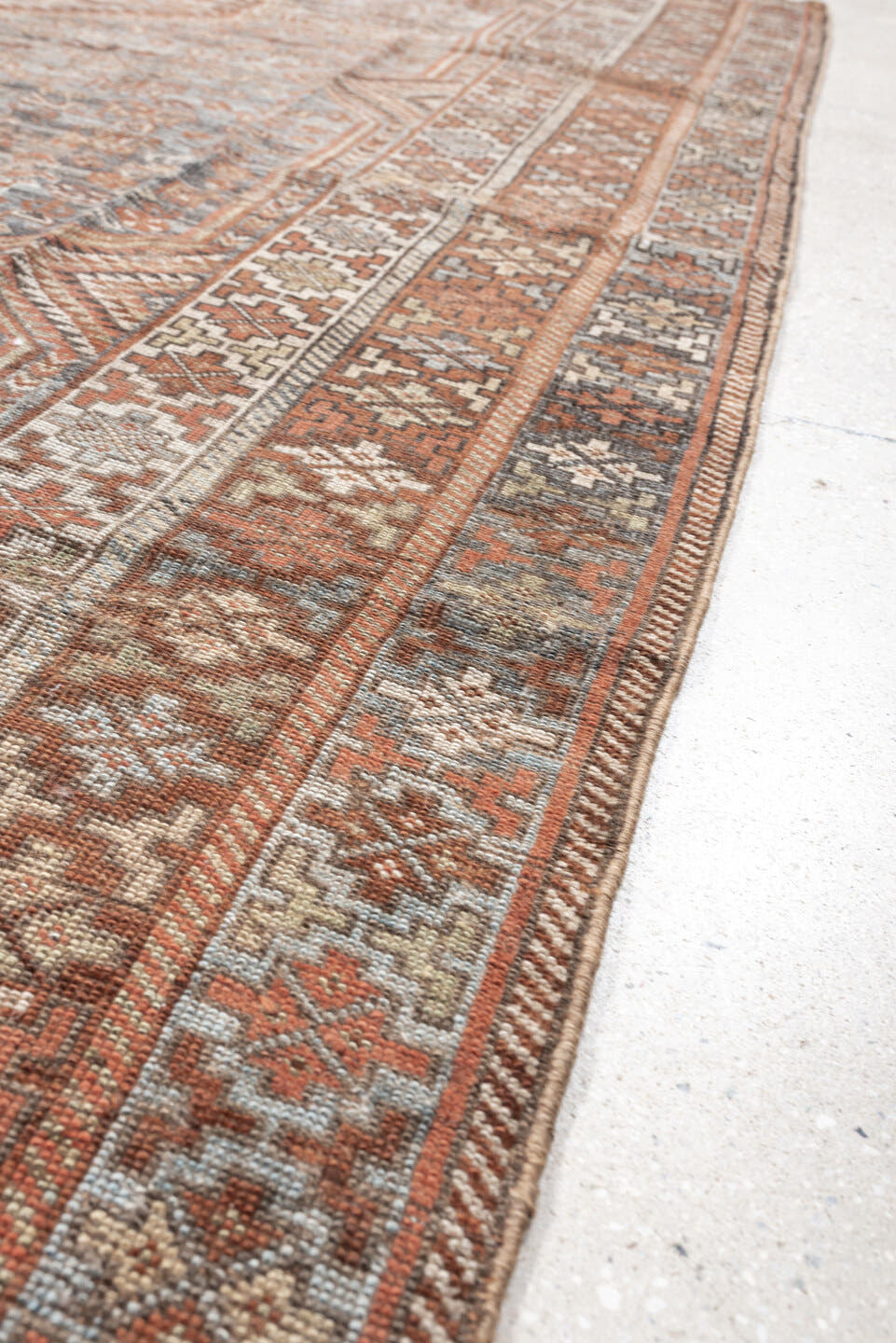 6' x 8' one-of-a-kind handmade antique Shiraz medium size rug. Color palette: blue, rust, ivory, taupe, slate, camel