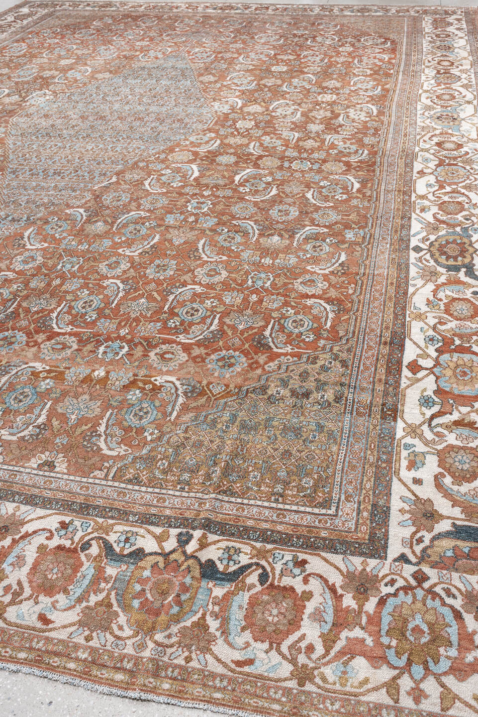 13' x 19' one-of-a-kind handmade antique Bibikabad oversize rug. Color palette: terra cotta, ivory, pale blue, taupe, camel
