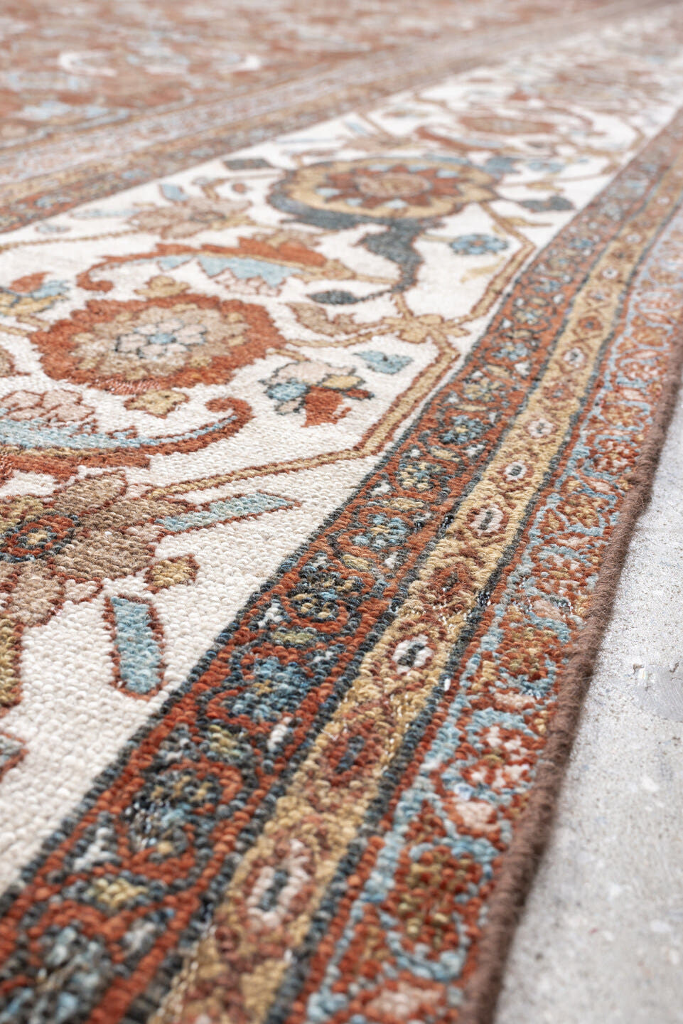 13' x 19' one-of-a-kind handmade antique Bibikabad oversize rug. Color palette: terra cotta, ivory, pale blue, taupe, camel