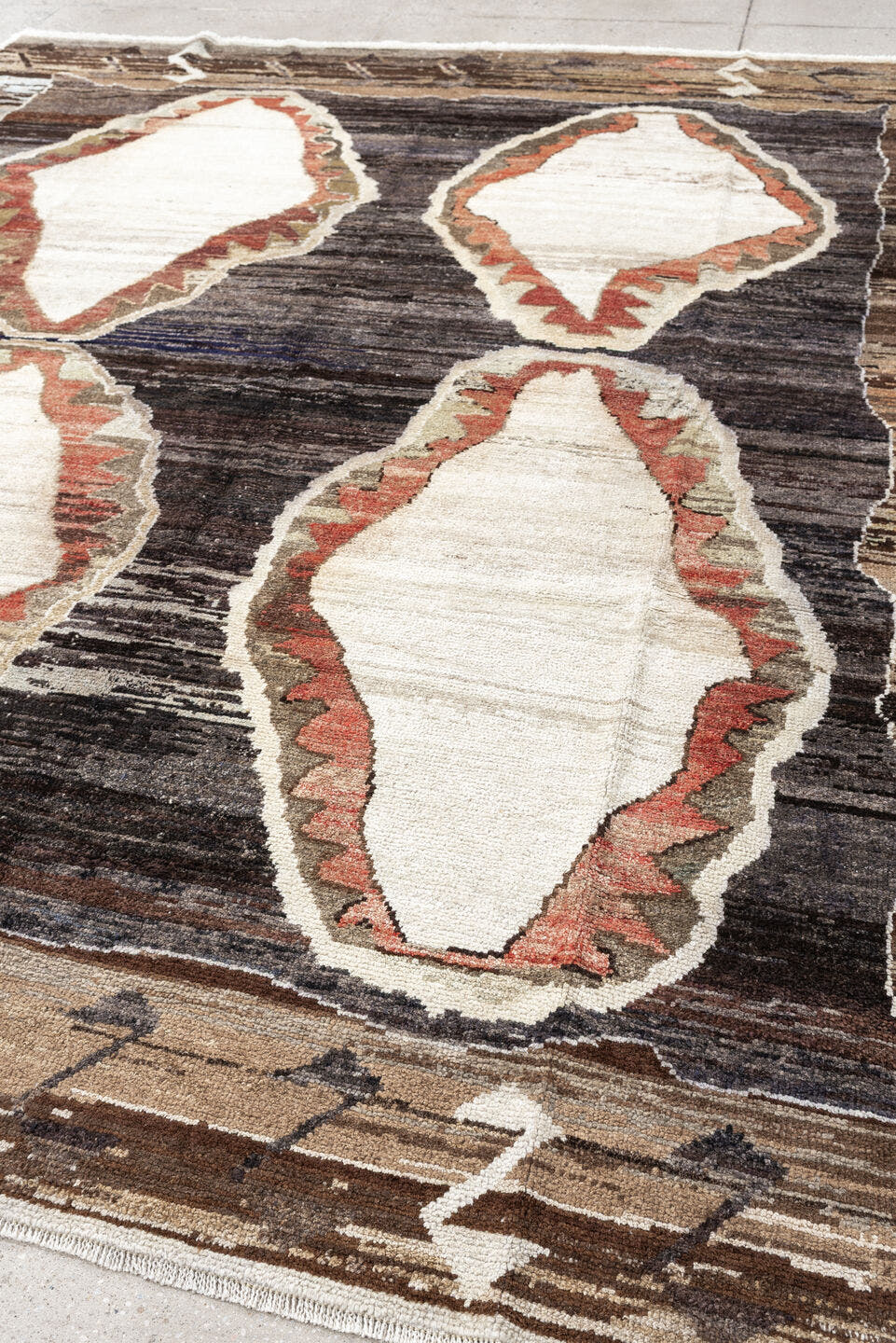 8' x 9' one-of-a-kind handmade antique Kars rug. Color palette: brown, ivory, taupe, charcoal, camel, coral, slate, cream