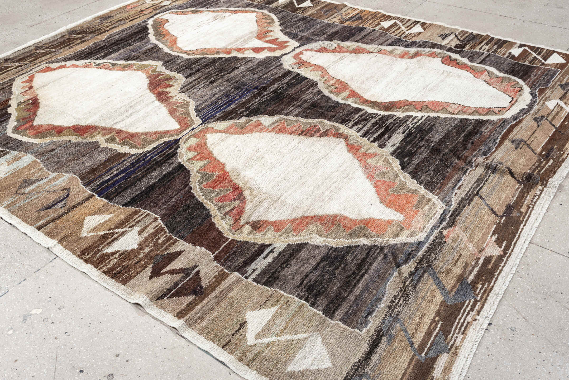 8' x 9' one-of-a-kind handmade antique Kars rug. Color palette: brown, ivory, taupe, charcoal, camel, coral, slate, cream