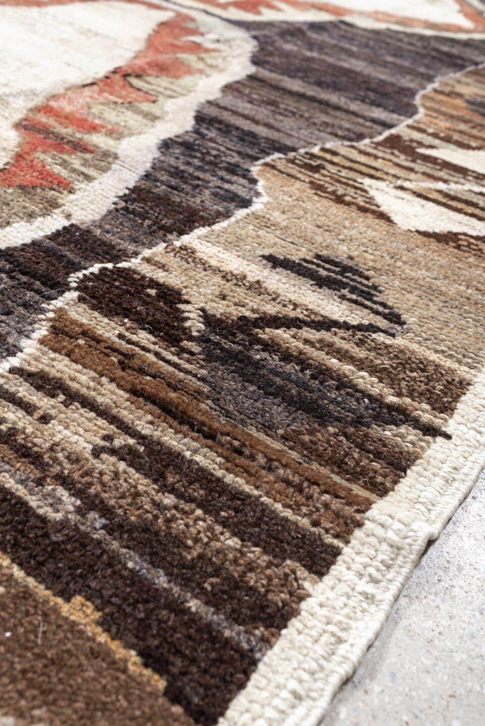 8' x 9' one-of-a-kind handmade antique Kars rug. Color palette: brown, ivory, taupe, charcoal, camel, coral, slate, cream