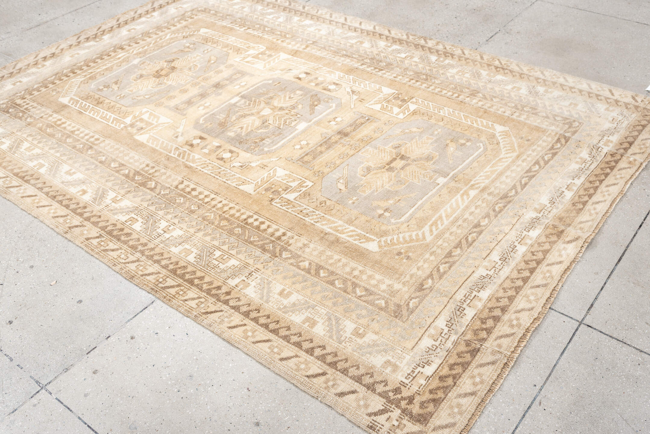 5' x 8' one-of-a-kind handmade antique Kars medium size rug. Color palette: ivory, camel, taupe, light gray, beige, sand