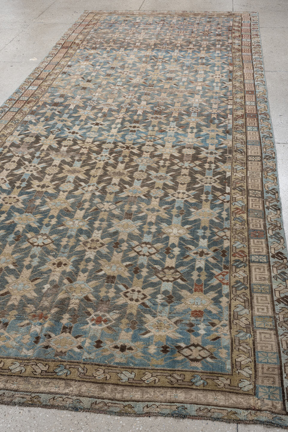 5' x 12' one-of-a-kind handmade antique Kurd rug. Color palette: sky blue, taupe, ivory, brown, beige, rust, light blue