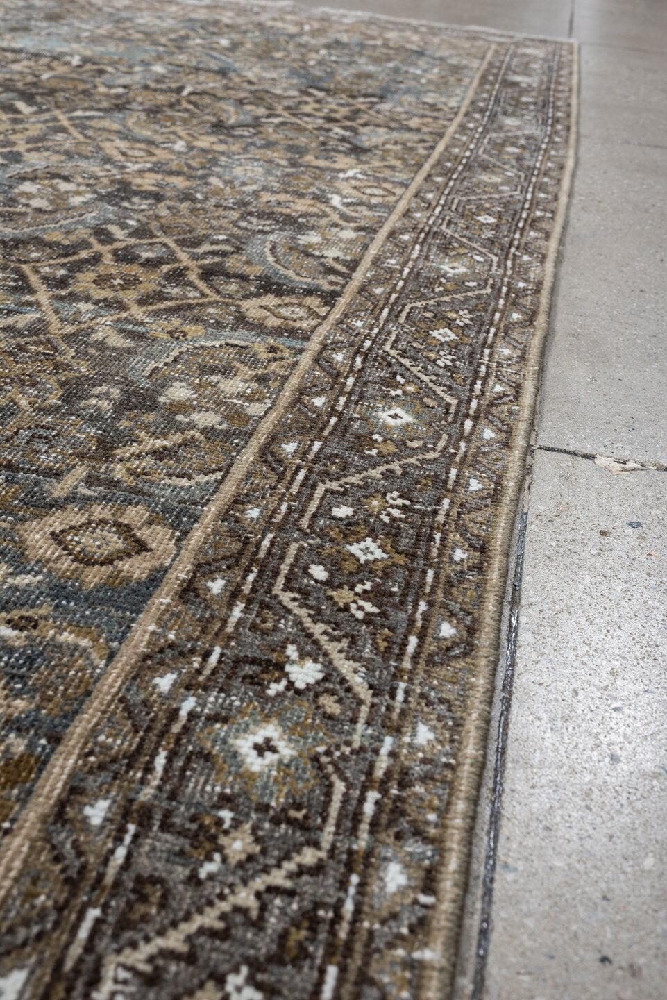 5' x 9' one-of-a-kind handmade antique Shiraz medium size rug. Color palette: taupe, brown, blue, ivory, charcoal, camel