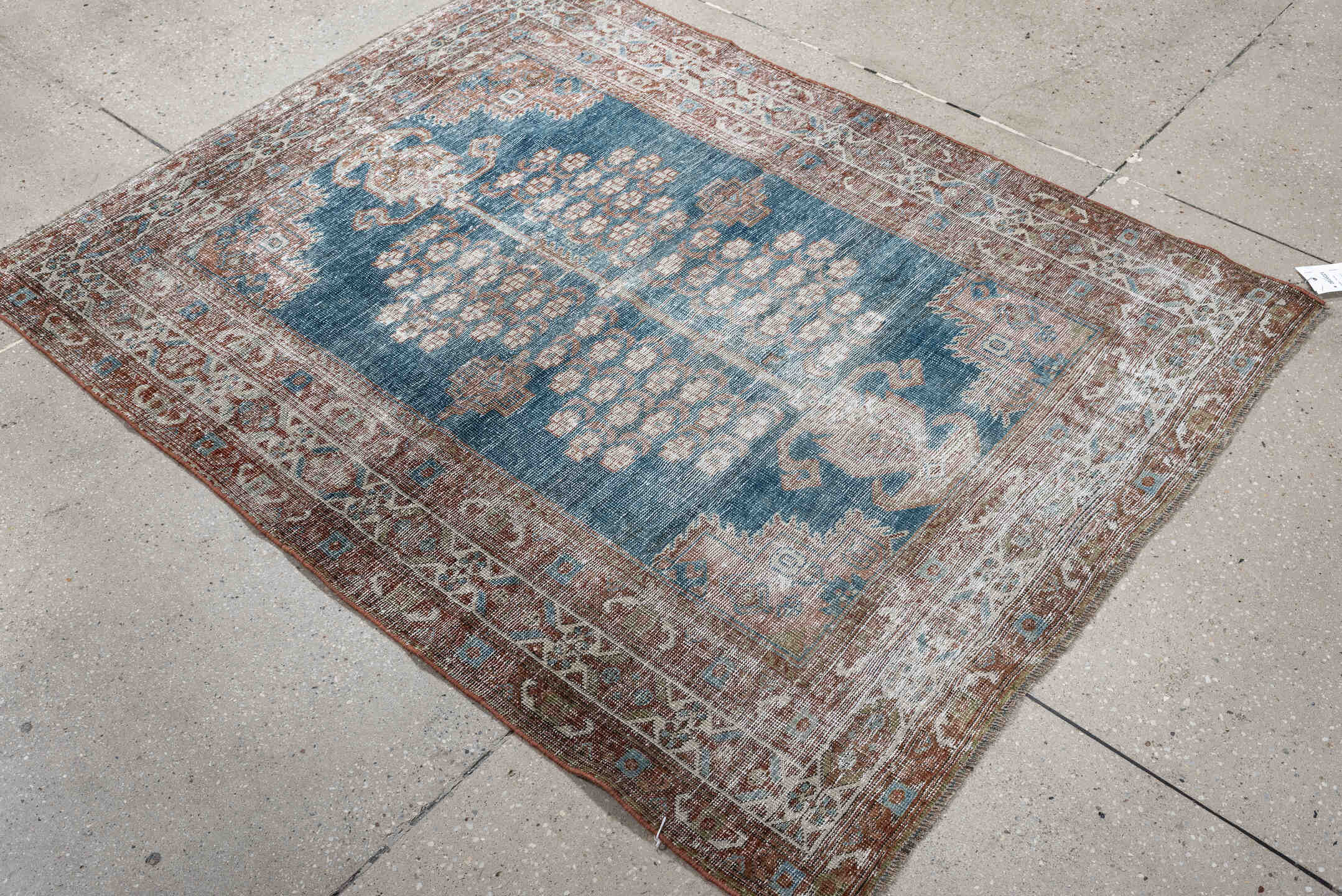 4' x 5' one-of-a-kind handmade antique Shiraz small size rug. Color palette: blue, rust, ivory, taupe, camel, terracotta