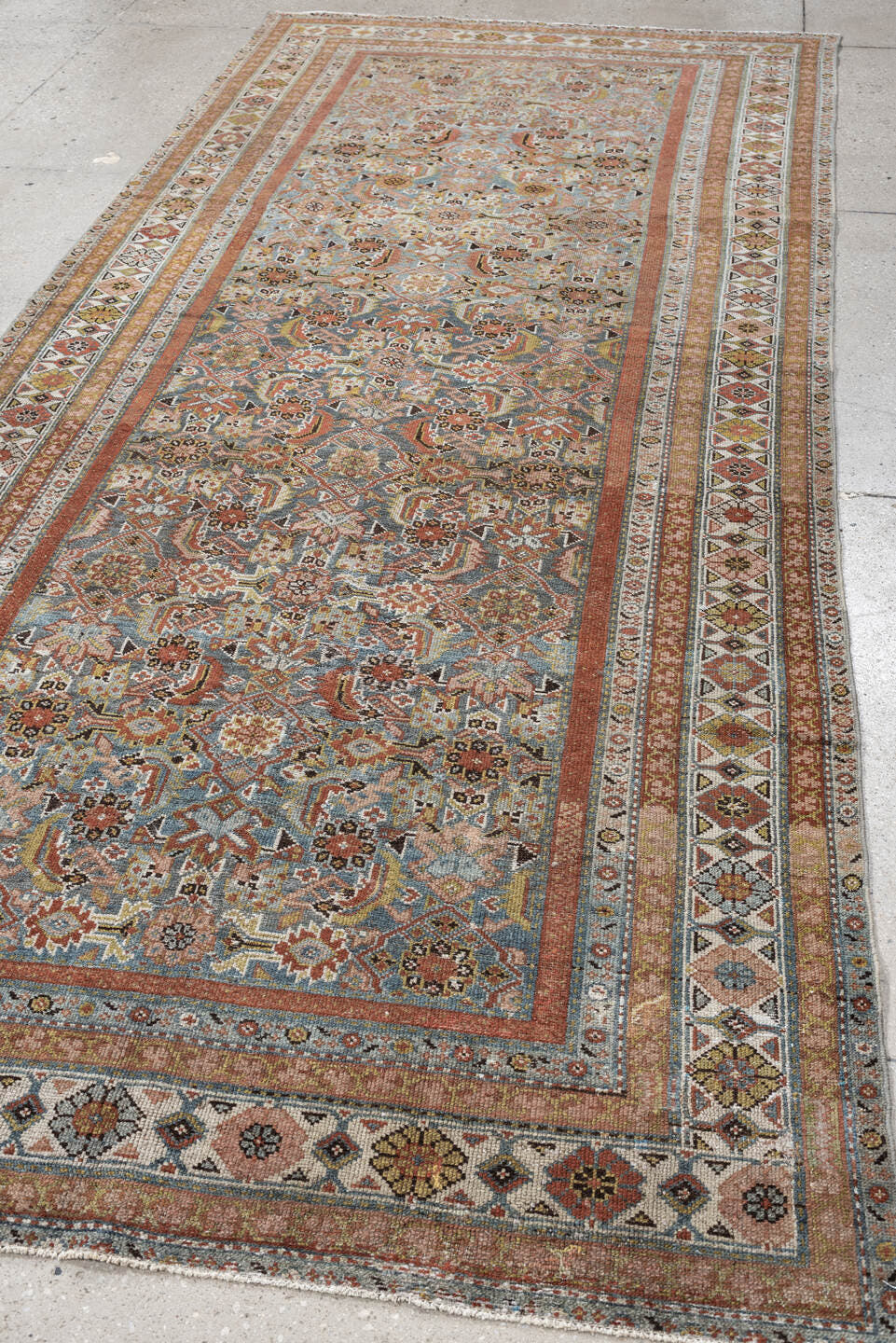 4' x 10' one-of-a-kind handmade antique Malayer runner rug. Color palette: blue, rust, ivory, taupe, sage, camel, charcoal