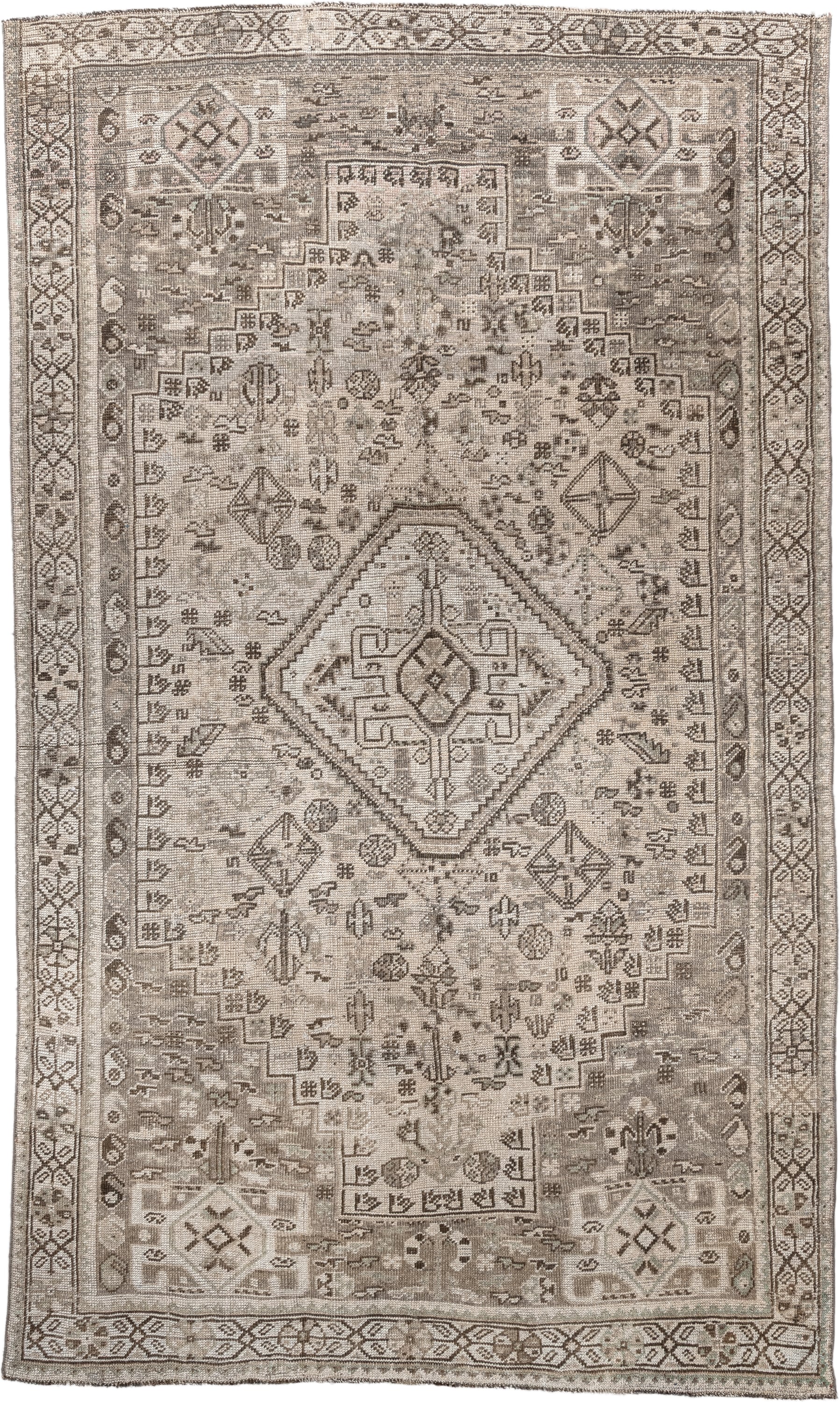 4' x 8' one-of-a-kind handmade antique Shiraz medium size rug. Color palette: taupe, ivory, brown, gray, beige