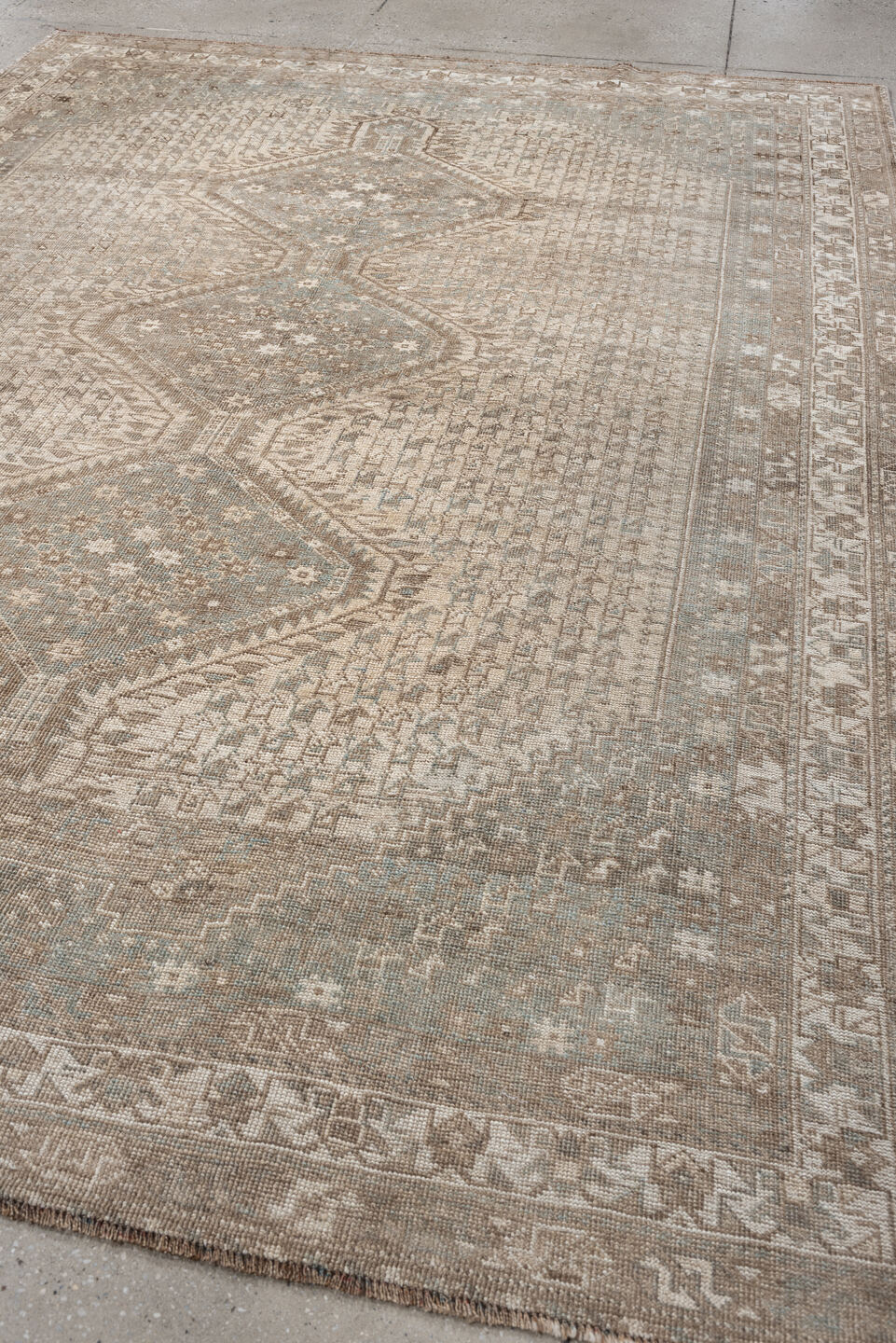 6' x 9' one-of-a-kind handmade antique Shiraz rug. Color palette: taupe, ivory, pale blue, beige, sand, camel, gray