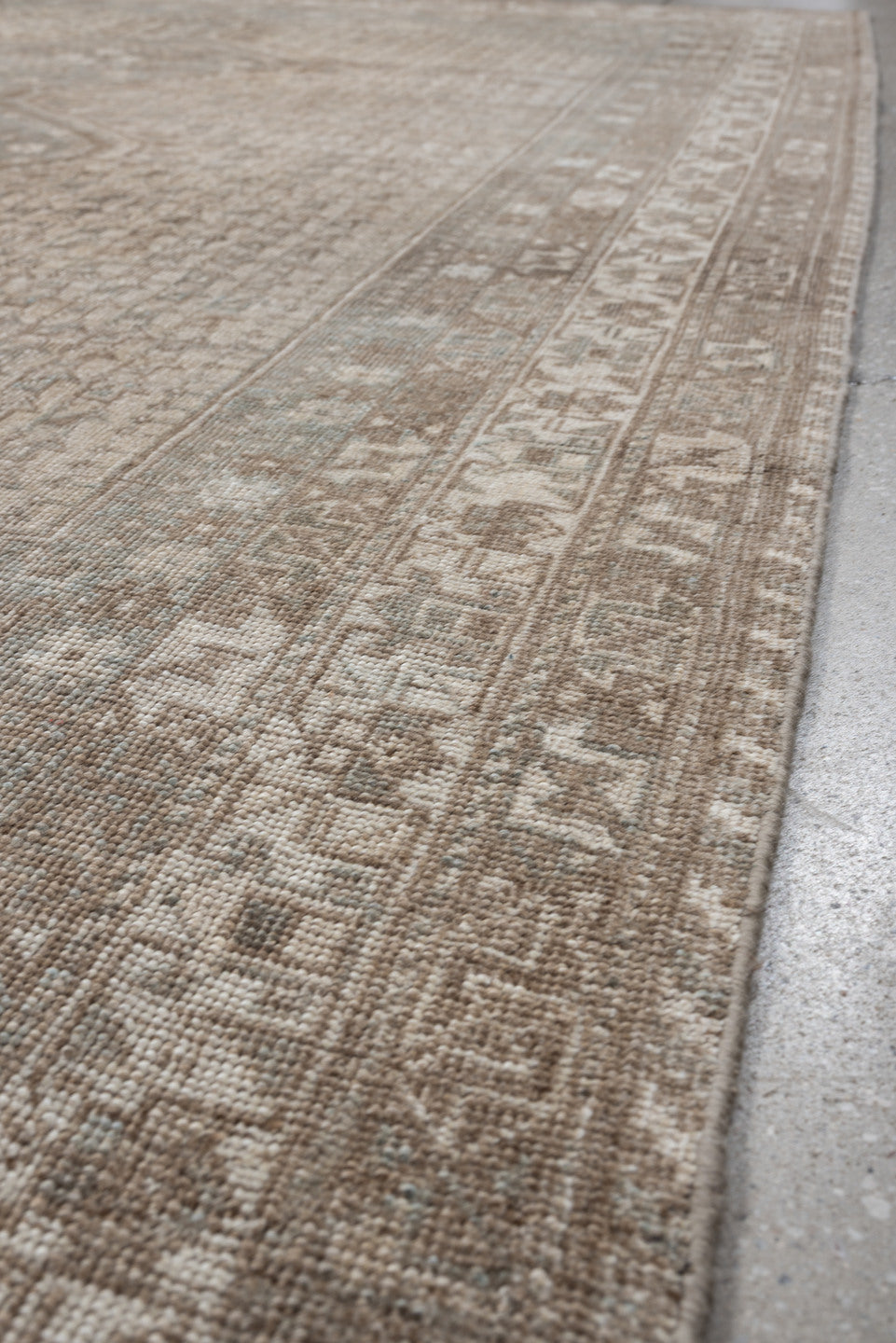 6' x 9' one-of-a-kind handmade antique Shiraz rug. Color palette: taupe, ivory, pale blue, beige, sand, camel, gray
