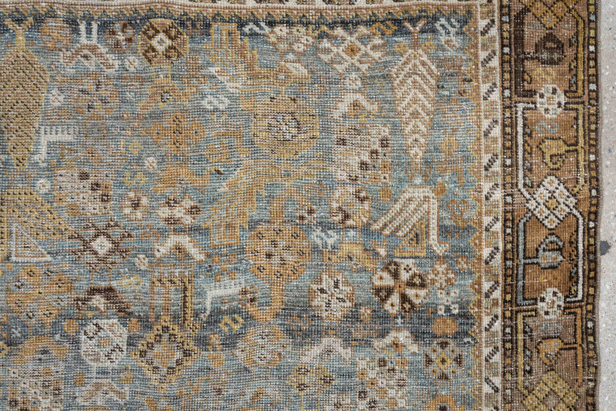4' x 6' one-of-a-kind handmade antique Shiraz rug. Color palette: sky blue, camel, ivory, taupe, brown, slate, gold