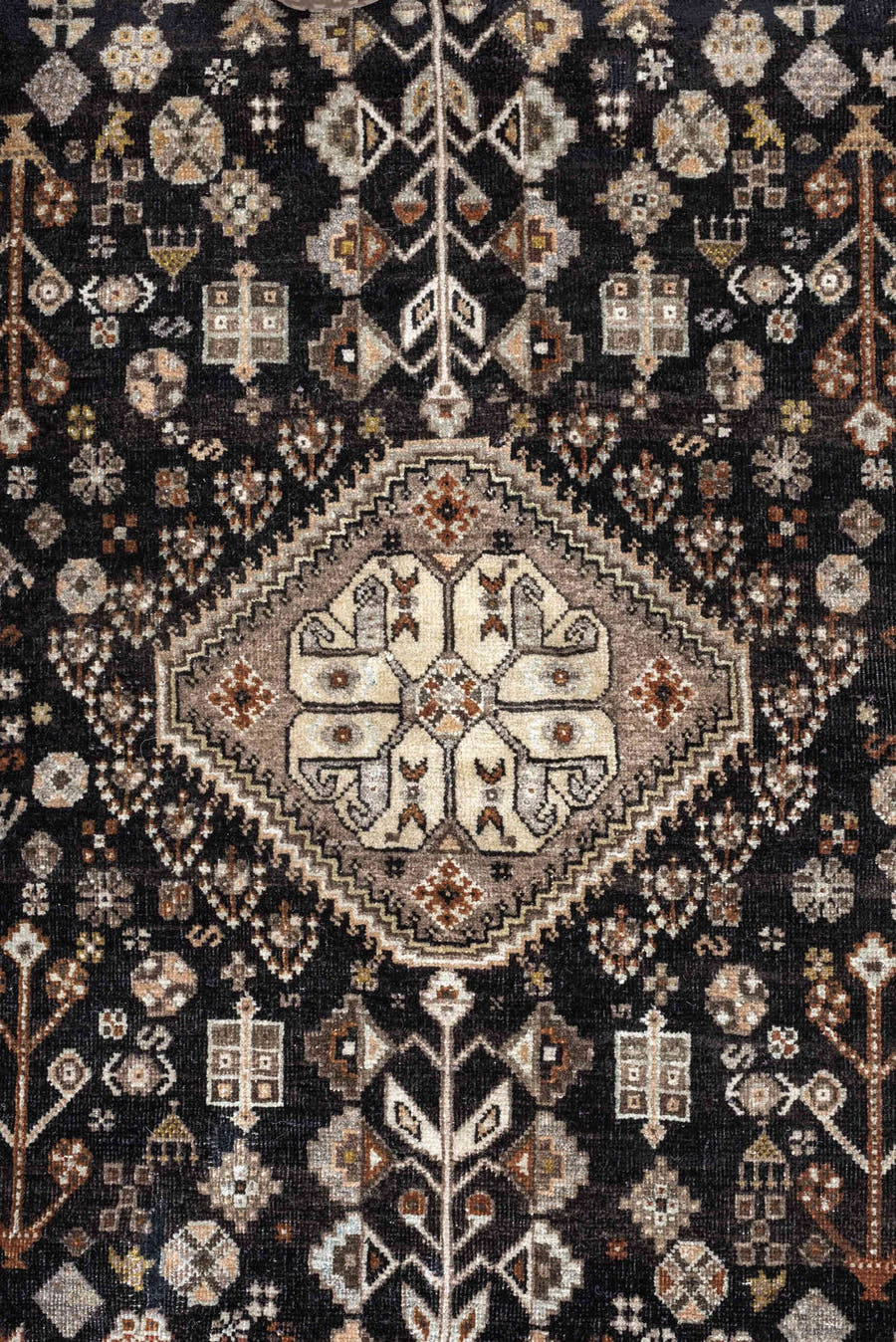 5' x 6' one-of-a-kind handmade antique Afshar rug. Color palette: charcoal, ivory, taupe, rust, pale blue, brown, camel