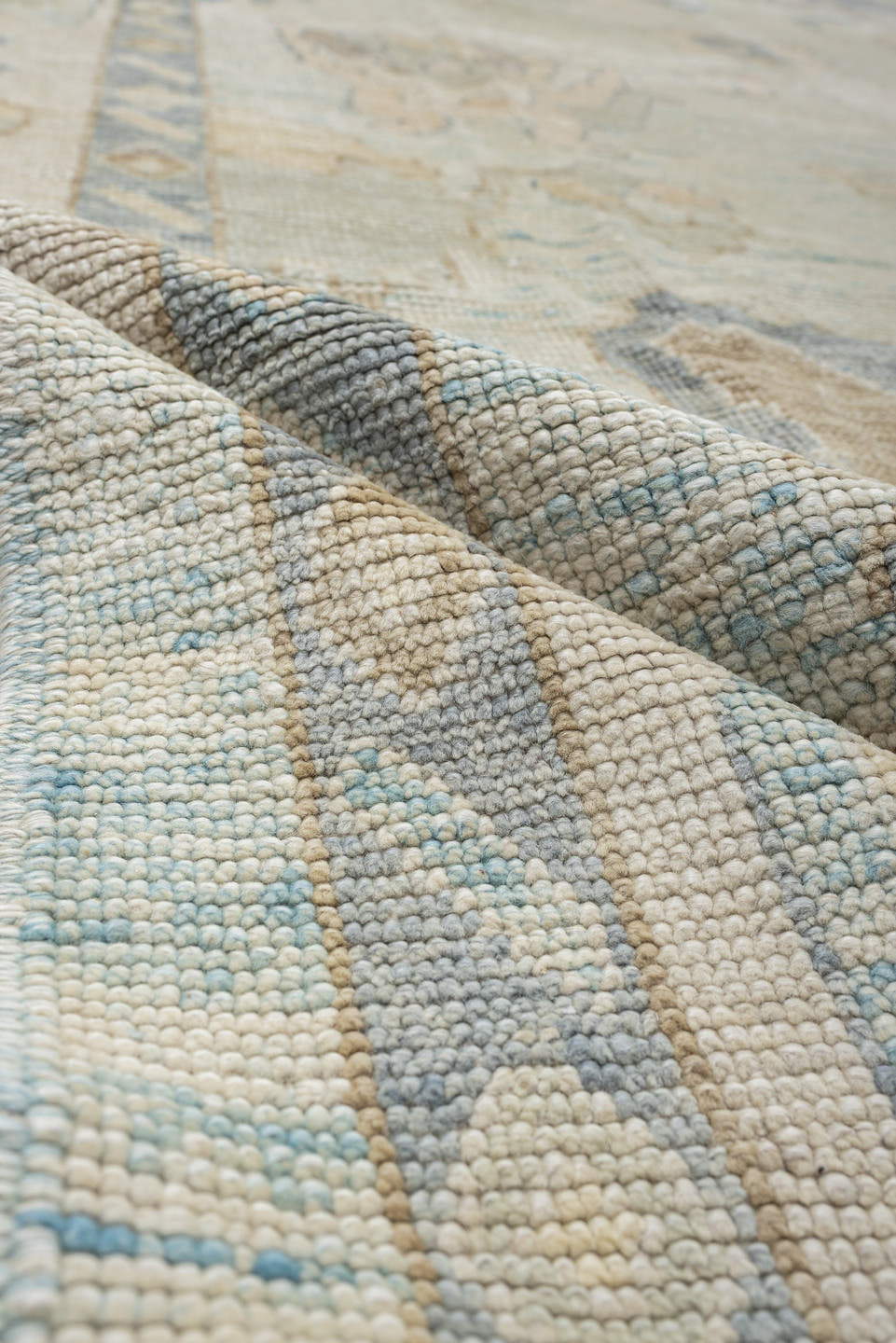 12' x 17' one-of-a-kind handmade vintage Oushak oversize rug. Color palette: ivory, pale blue, beige, taupe, cream, sage