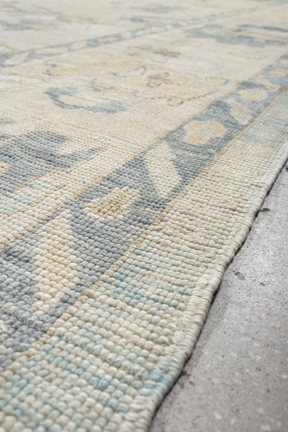 12' x 17' one-of-a-kind handmade vintage Oushak oversize rug. Color palette: ivory, pale blue, beige, taupe, cream, sage