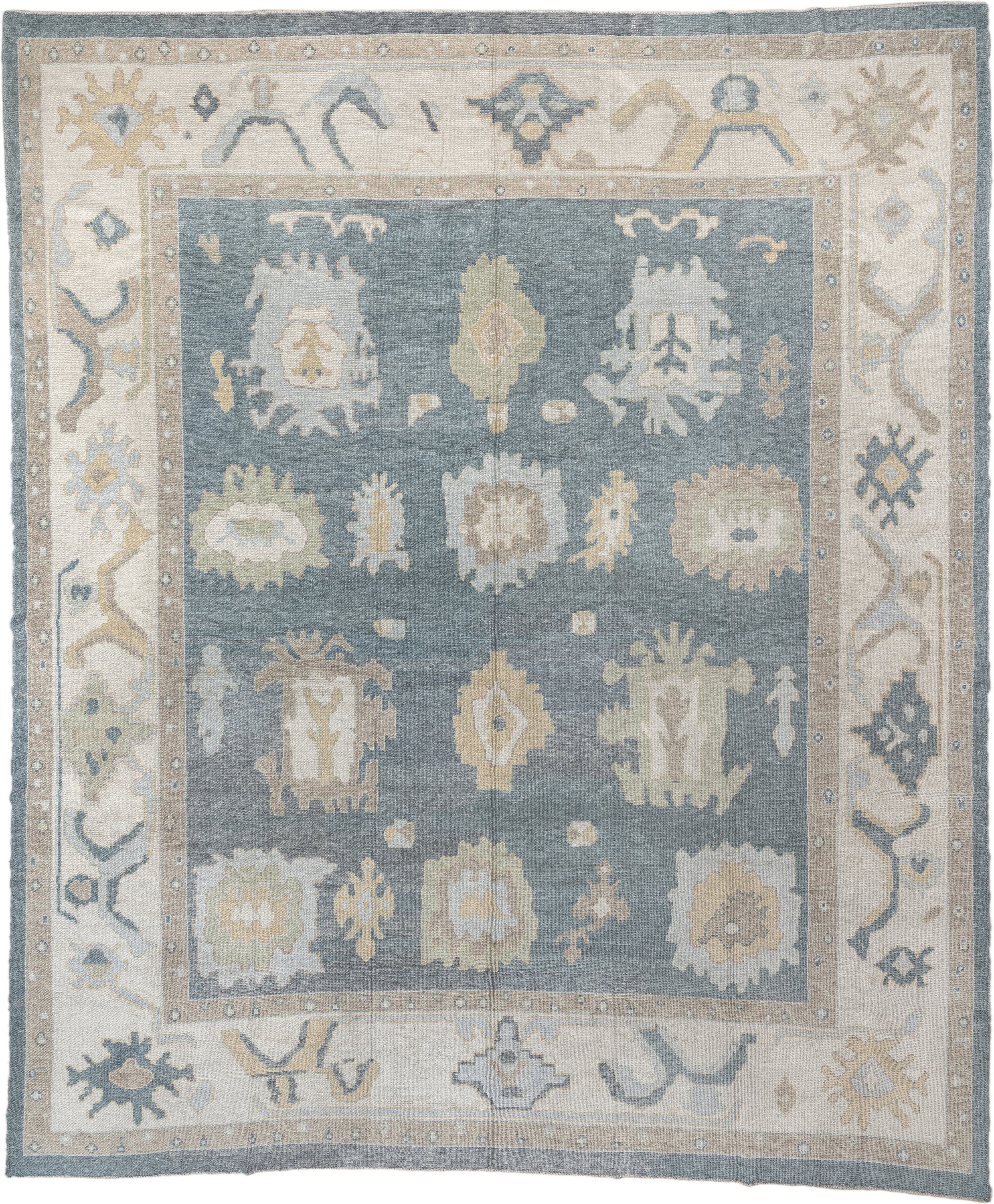 13' x 16' one-of-a-kind handmade vintage Oushak oversize rug. Color palette: blue, ivory, beige, taupe, sage, gold, gray