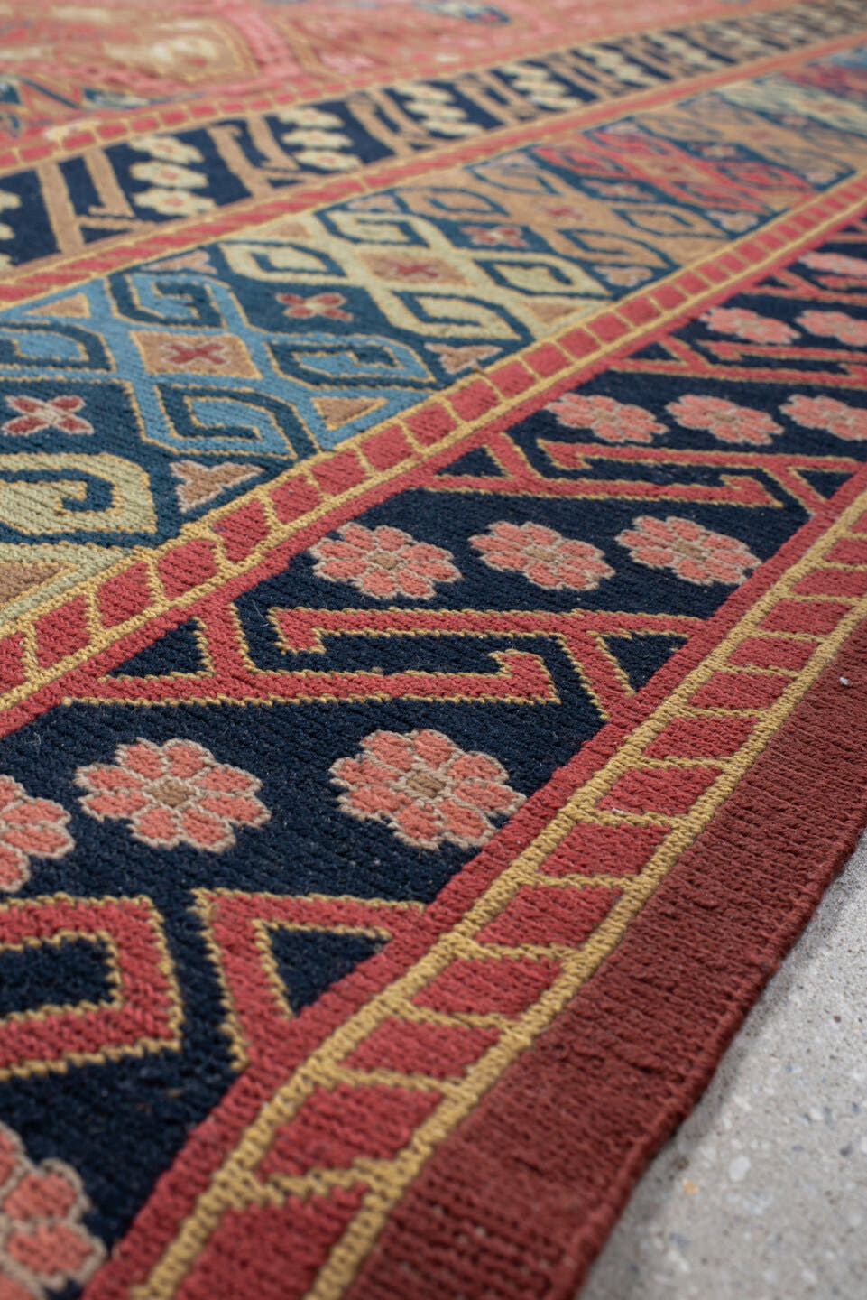 8' x 11' one-of-a-kind handmade vintage Sumak large size rug. Color palette: terra cotta, navy, ivory, sky blue, rust, rose