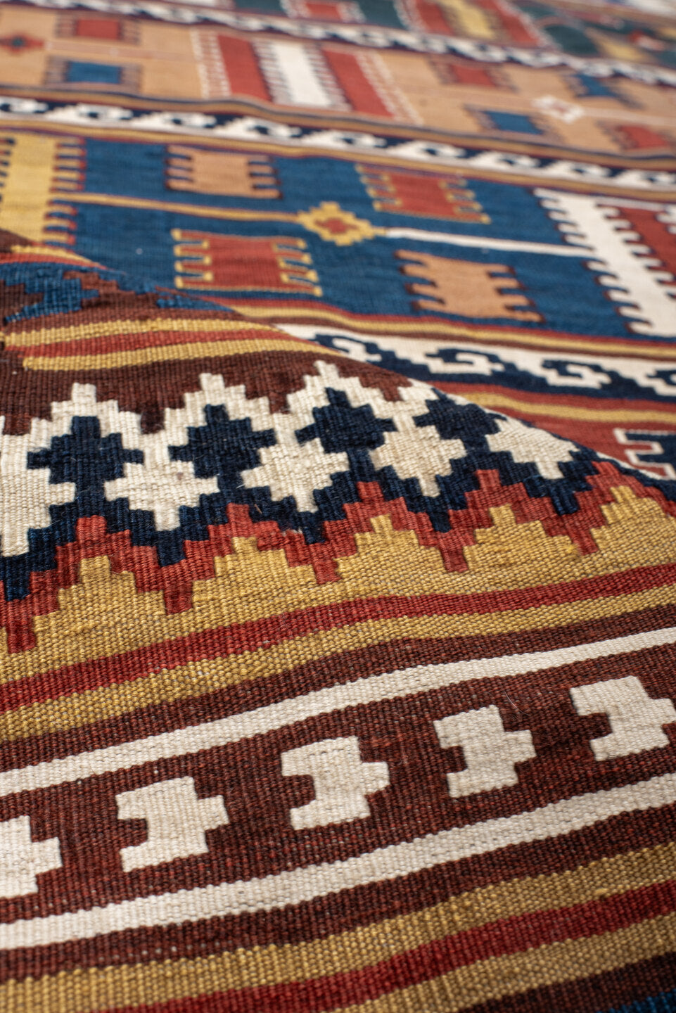 5' x 9' one-of-a-kind handmade vintage Kilim medium size rug. Color palette: rust, ivory, indigo, camel, teal, brown, navy