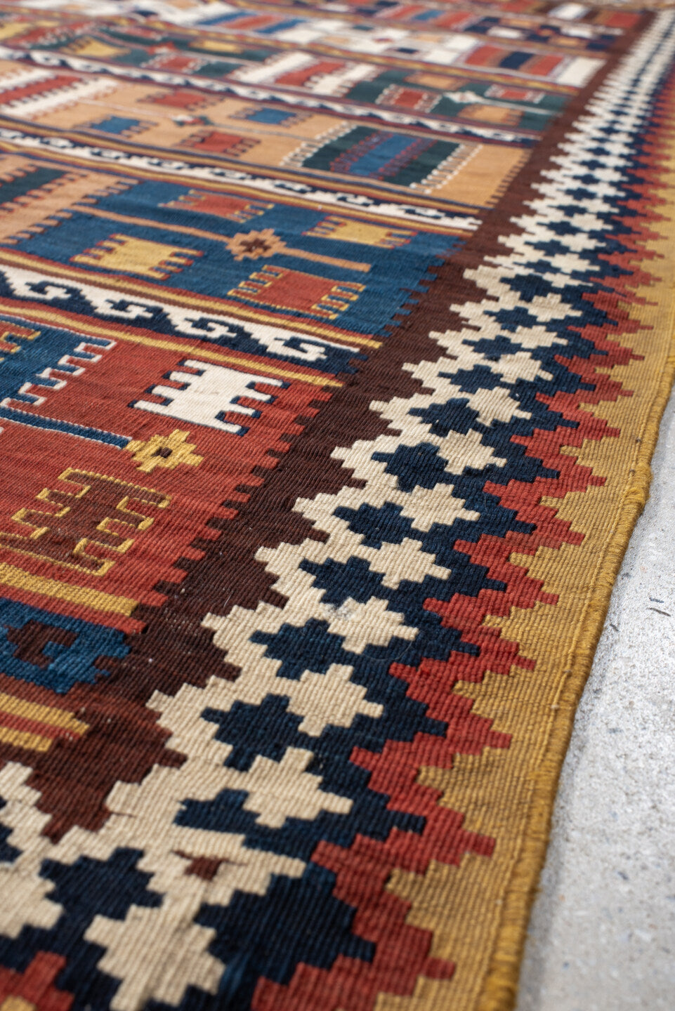 5' x 9' one-of-a-kind handmade vintage Kilim medium size rug. Color palette: rust, ivory, indigo, camel, teal, brown, navy