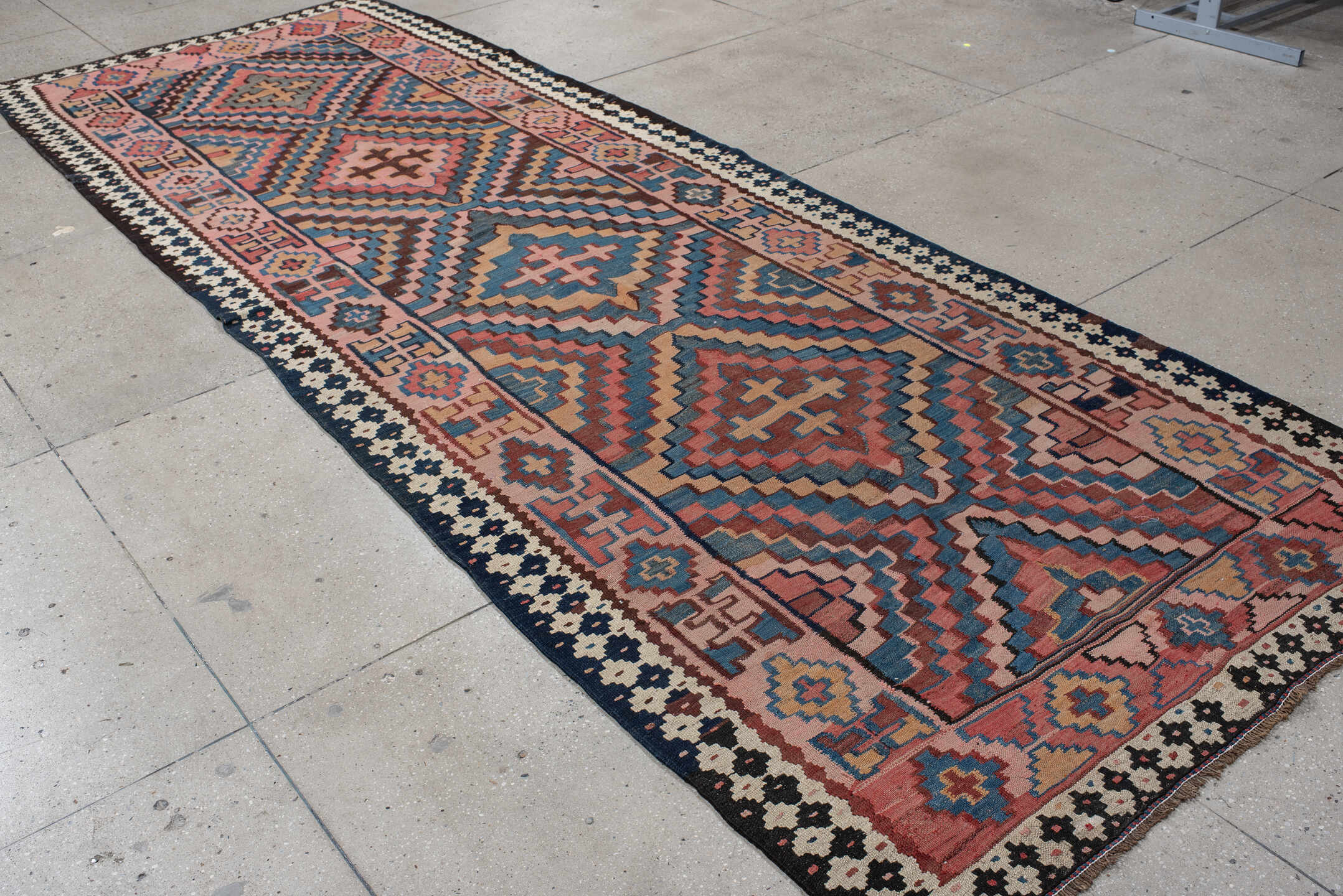 5' x 14' one-of-a-kind handmade vintage Kilim runner rug. Color palette: rose, indigo, ivory, rust, teal, camel, charcoal