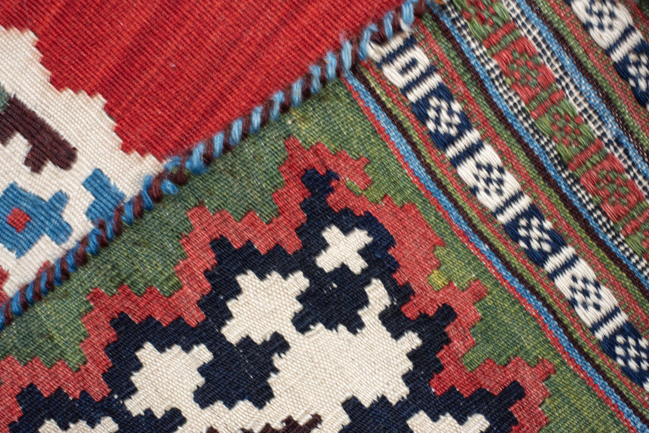 5' x 7' one-of-a-kind handmade vintage Kilim rug. Color palette: rust, ivory, navy, sky_blue, olive, red, teal, brown