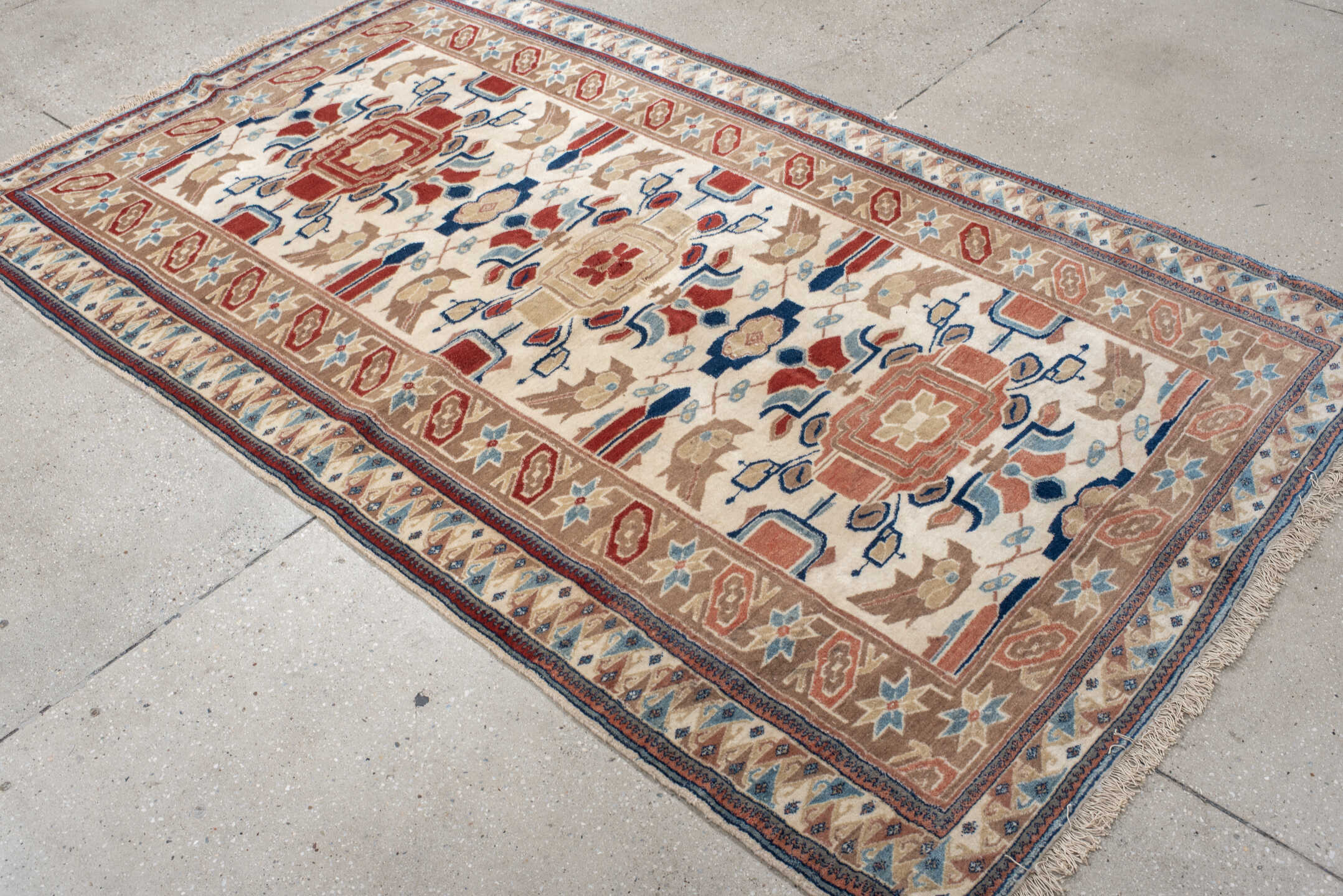 4' x 7' one-of-a-kind handmade vintage Ardebil rug. Color palette: ivory, camel, rust, sky blue, navy, taupe, terracotta