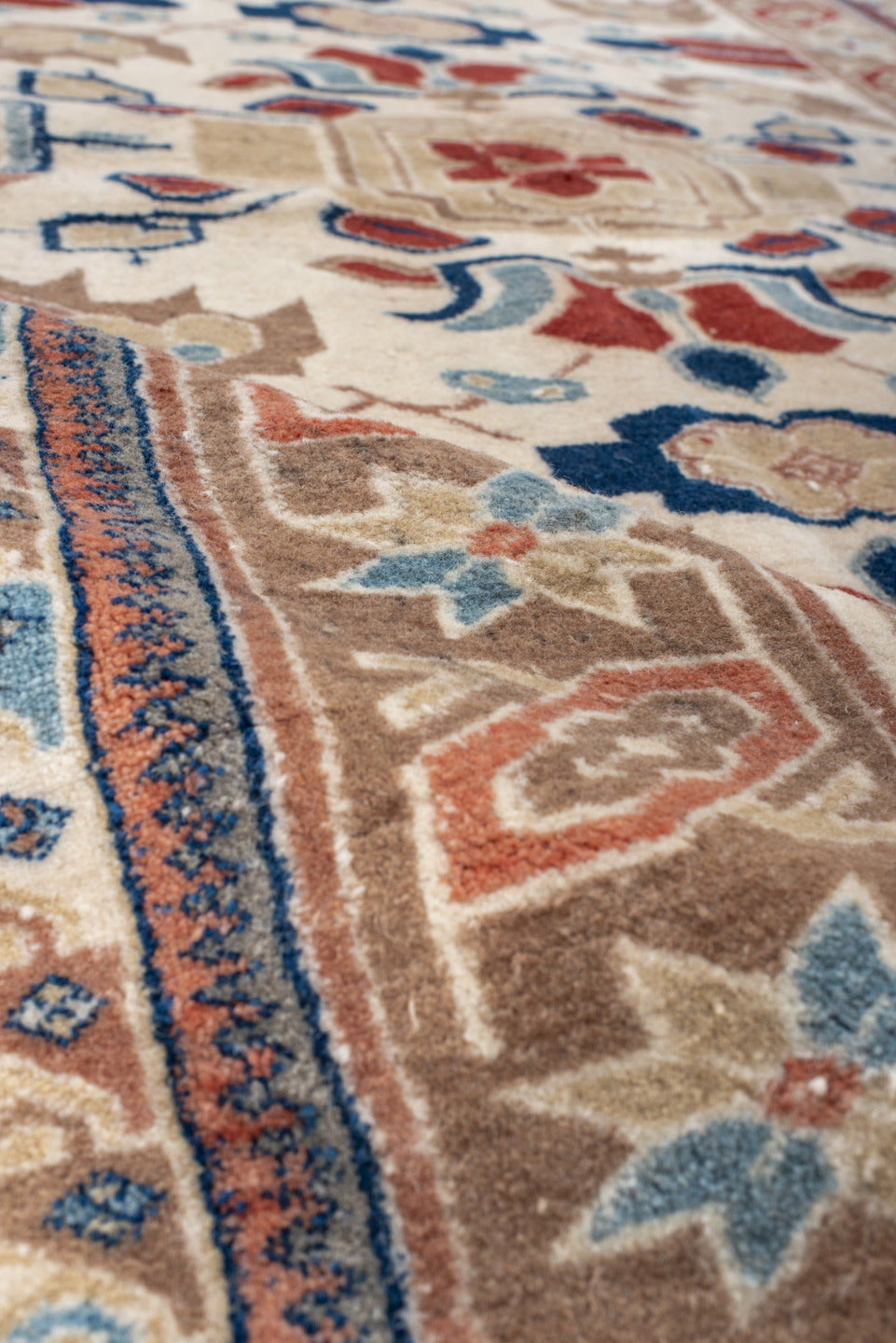 4' x 7' one-of-a-kind handmade vintage Ardebil rug. Color palette: ivory, camel, rust, sky blue, navy, taupe, terracotta