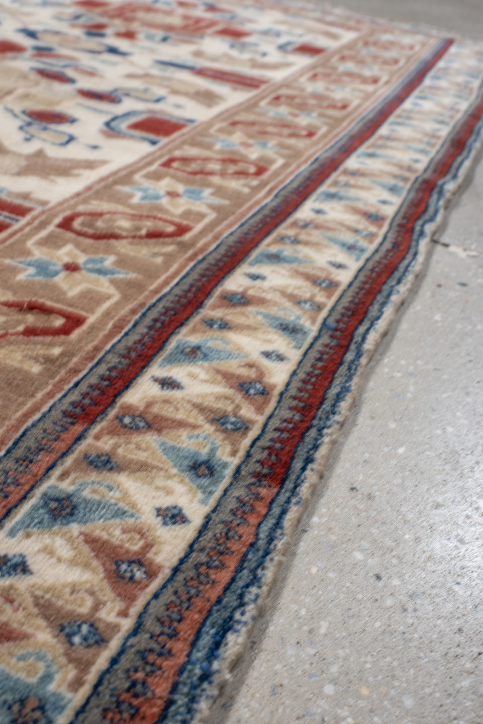 4' x 7' one-of-a-kind handmade vintage Ardebil rug. Color palette: ivory, camel, rust, sky blue, navy, taupe, terracotta